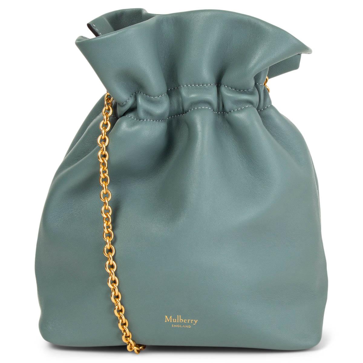 100% authentic Mulberry mini Lynton bucket bag in Antique Celeste (grey-green-blue) smooth lamb nappa leather with the label's moniker in gold-tone lettering at front. Comes with a gold-tone metal chain and is lined in deep burgundy leather with one