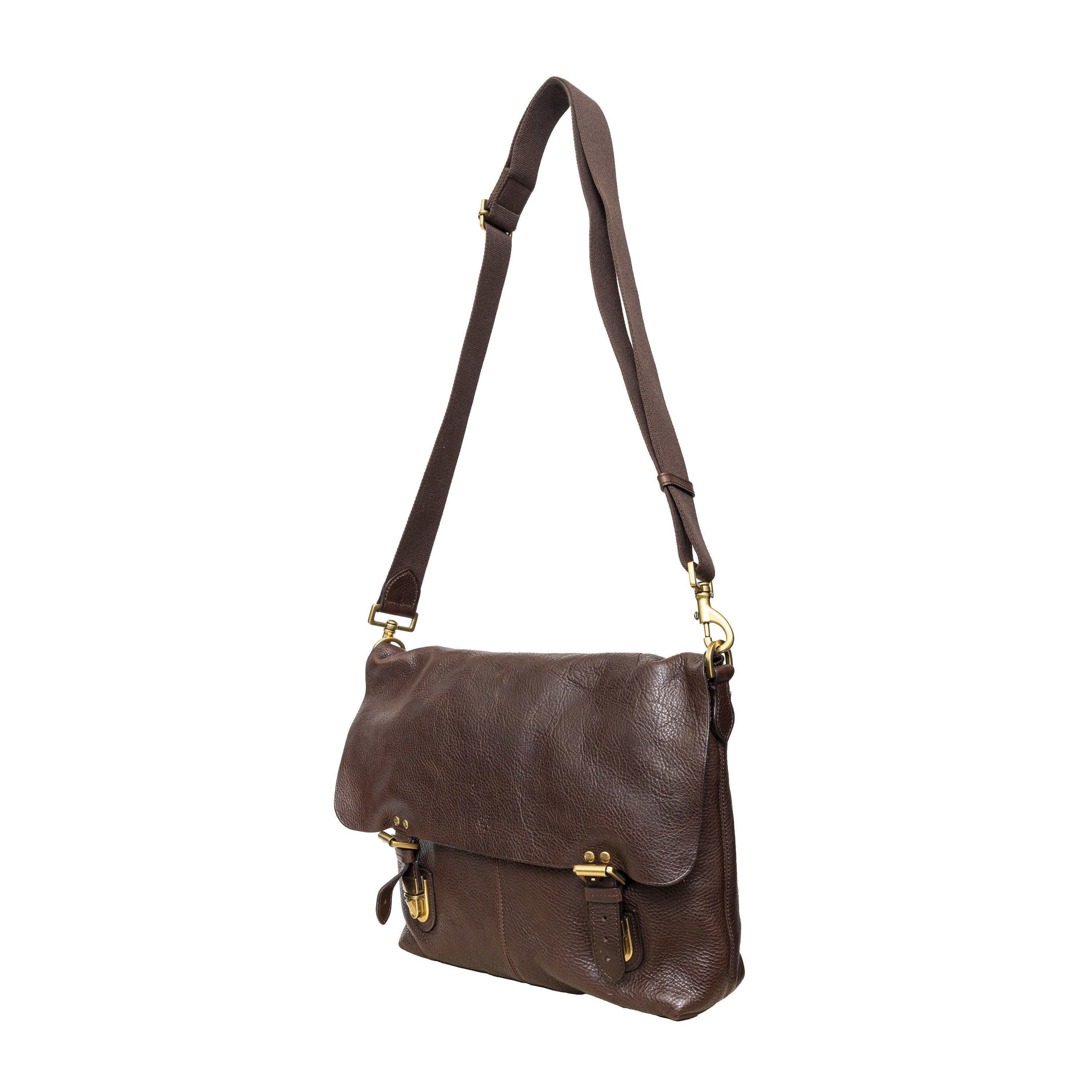 Crafted from dark brown leather, this soft messenger bag features an adjustable canvas shoulder strap, golden hardware, a buckled flap closure, and a suede interior.
 Remarks: There is one small scratch. 
 Measurement: Height:33;Width:39;Depth:8 
