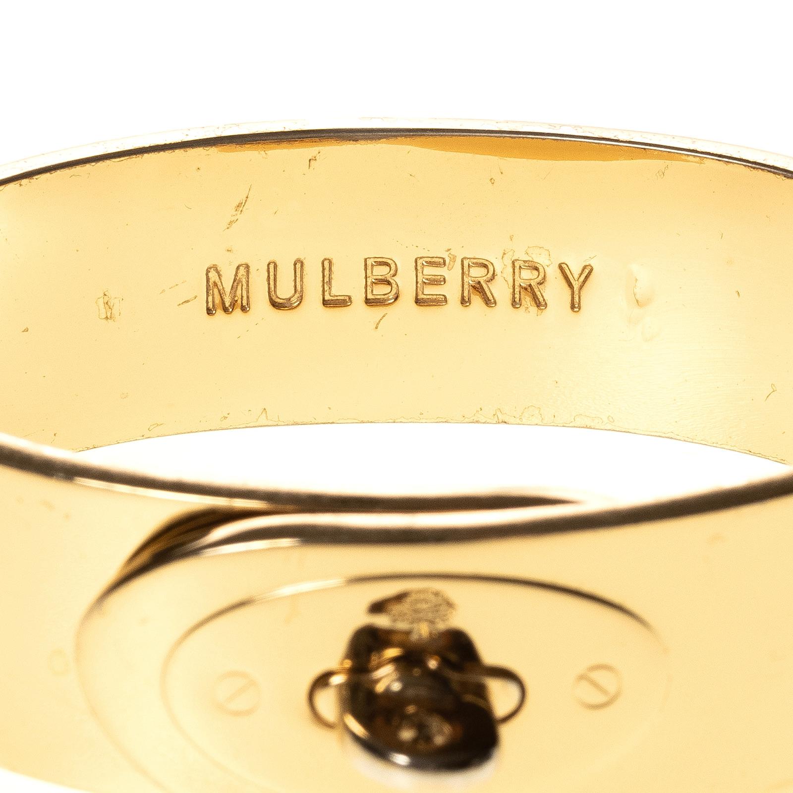 Mulberry gold-tone metal Bayswater Bracelet features hinge & turn-lock closures. Logo on the interior.

COLOR: Gold 
MATERIAL: Gold-tone metal 
MEASURES: inside circumference: 7.5”, W: 0.8”
EST. RETAIL: 425.00 
CONDITION: Good - faint scratches and
