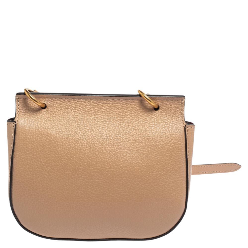 Stay updated in contemporary fashion by bringing home this shoulder bag by Mulberry. It has been crafted from quality leather and comes in a lovely shade of beige. It has a front flap, gold-tone hardware, and a suede interior.

Includes: Original
