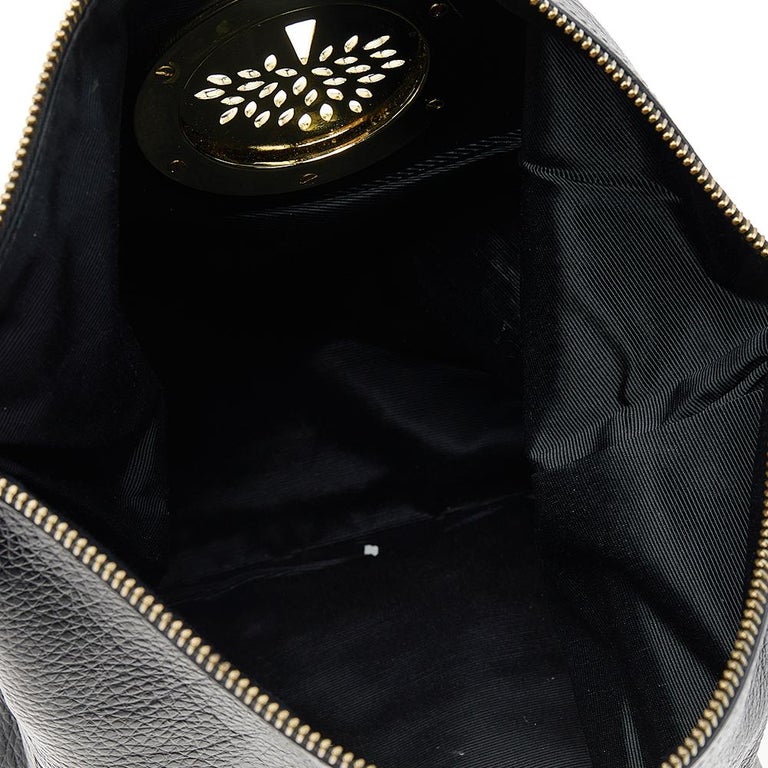 Mulberry - a Mulberry Daria clutch bag in black leather, gold tone  signature tree plaque, fold over flap with external zip closure, cross  grain lined interior with both internal zip pocket and