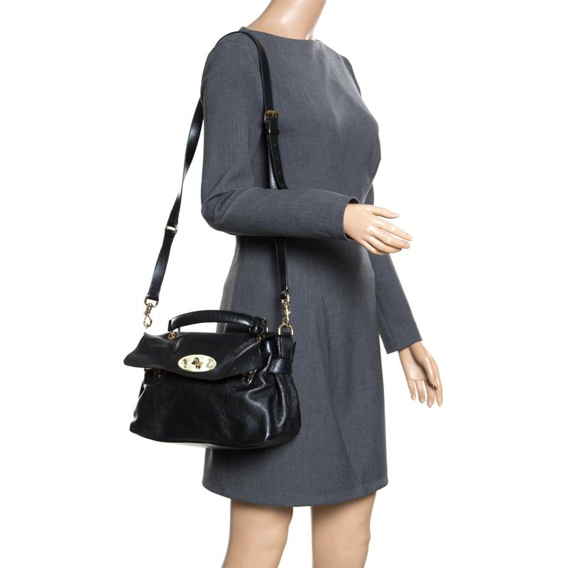 This bag from Mulberry is high on style and magnificent in appeal. The bag features a postmans lock, clochette and top handle that is attached with rings. The flap opens to a fabric lined roomy interior with a zipped pocket to keep all your daily