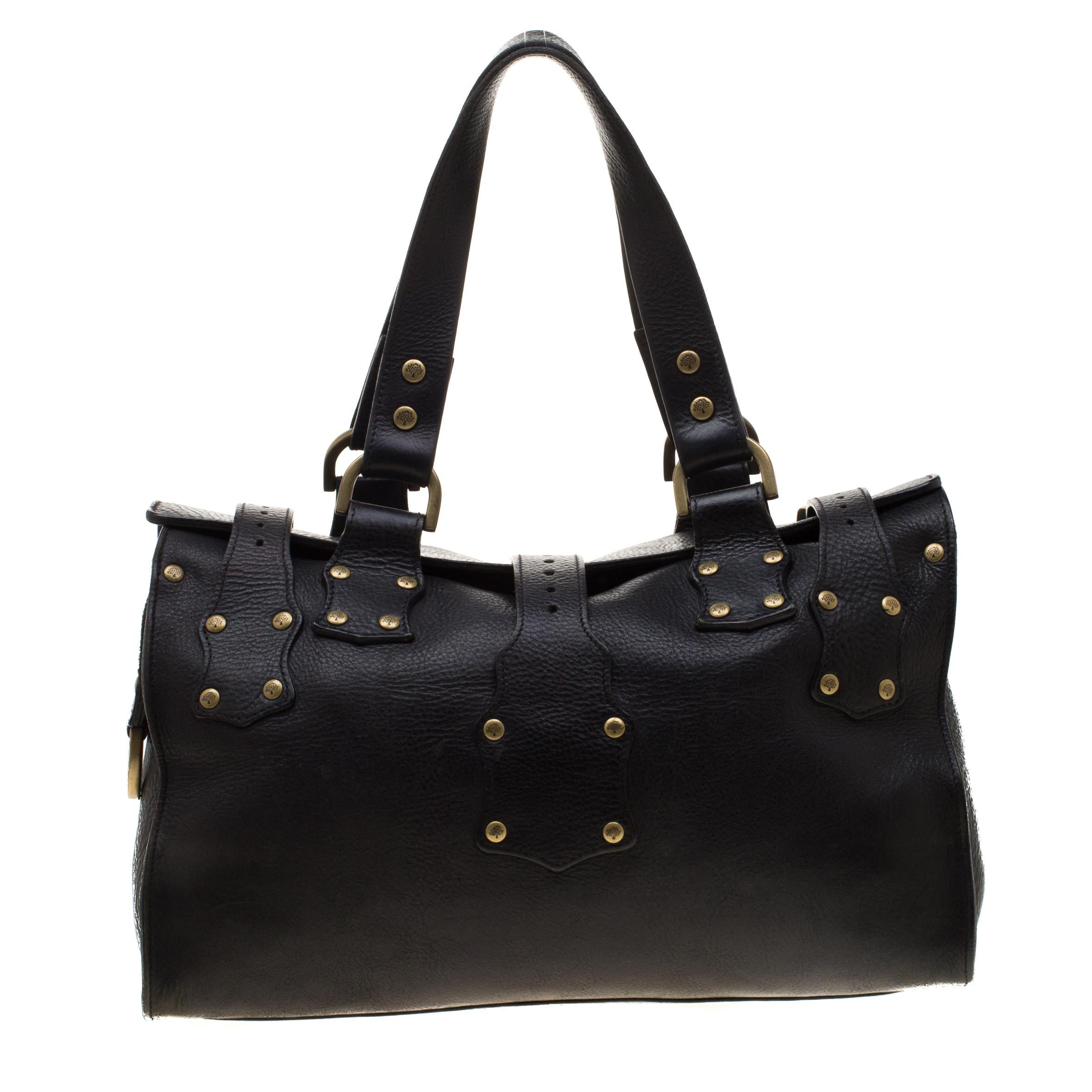 This lovely Mulberry design has been crafted from leather and designed with front pockets and buckles. The black bag has two handles and a spacious suede interior to carry all your essentials.

Includes: Original Dustbag

