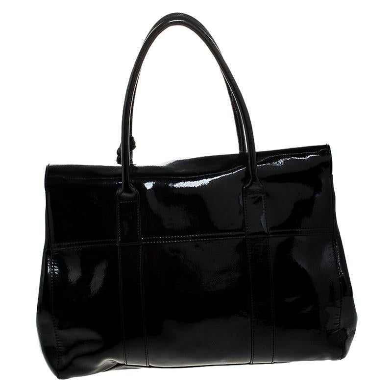 The Bayswater is one of the most well-known collections from Mulberry, so it's fair to say that this satchel is worth the buy. Crafted from glossy black patent leather, the bag is equipped with two handles and a turn lock on the flap securing a