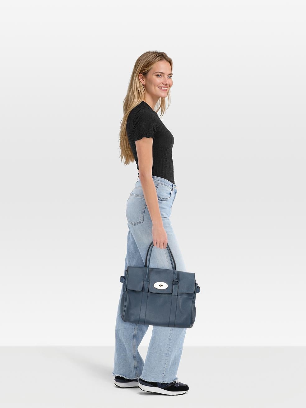 CONDITION is Very good. Minimal wear to the bag is evident. Scratching to all hardware across the bag and tarnishing to the base feet. Pealing and cracking to the leather seal on both handles. Abrasion to all leather areas across the bag. Marks and