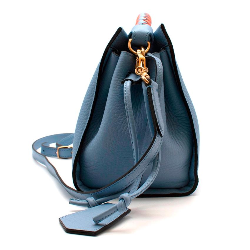 Mulberry Blue Leather Small Iris Bag with Braided Handle 

-Luxurious soft leather 
-Modern soft structure
-Double pull cords to either side that allow for a personalized shape
-Braided top handle
-Long shoulder strap, adjustable with a buckle