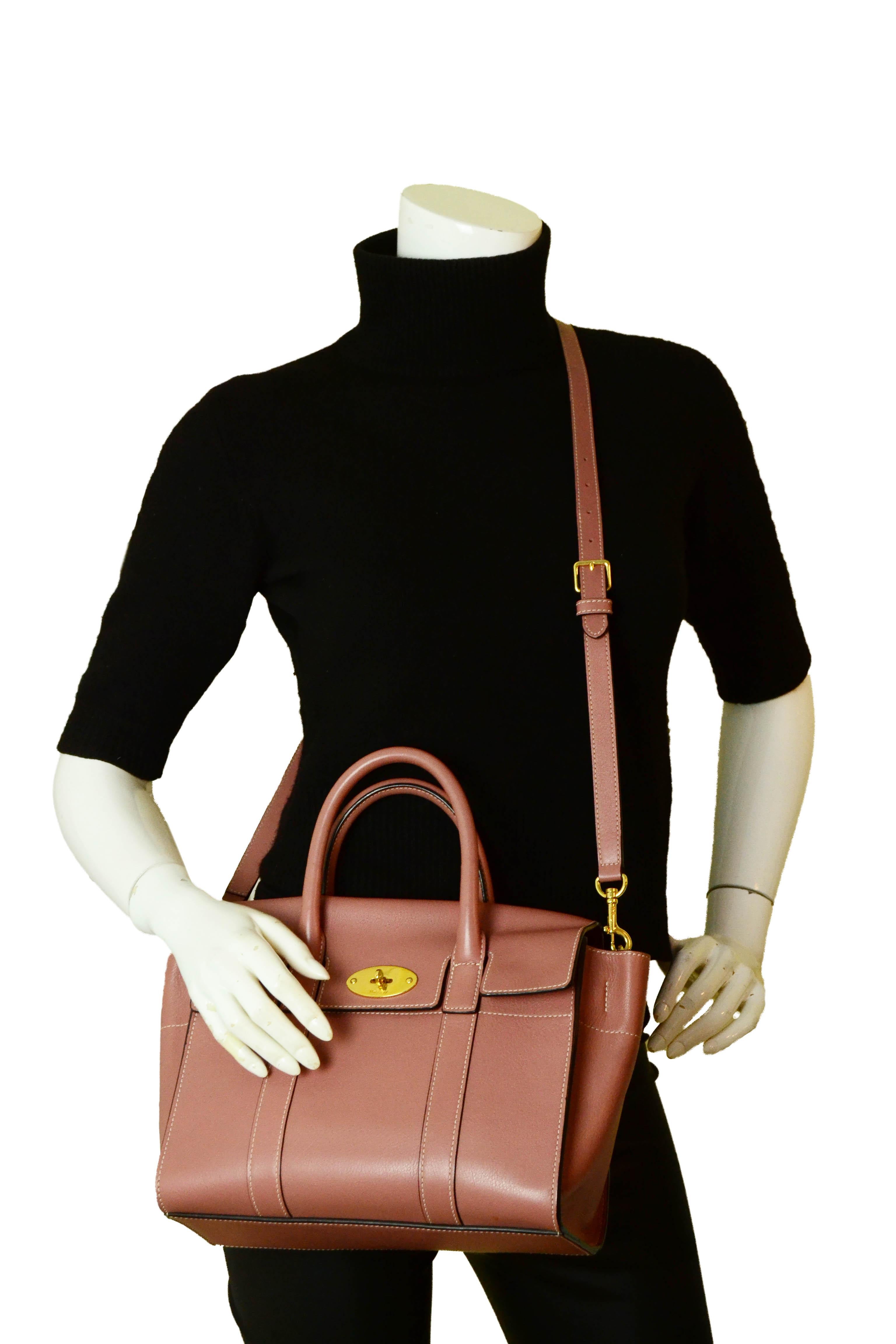 Mulberry Blush Pink Leather Small Bayswater Crossbody Bag

Made In: Turkey
Color: Blush pink
Hardware: Goldtone
Materials: Leather
Lining: Suede
Closure/Opening: Flap top with twist-lock
Exterior Pockets: None
Interior Pockets: One zipper and one