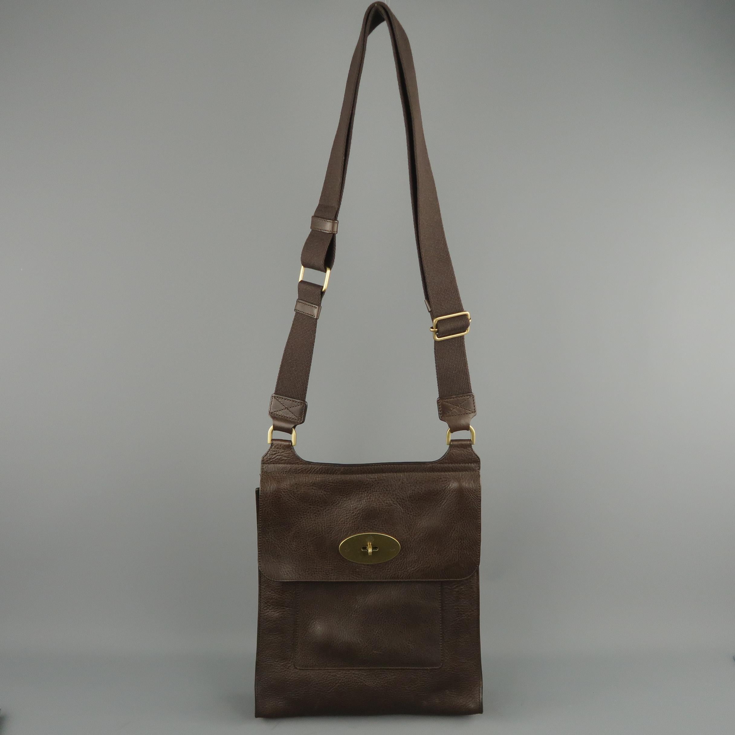 MULBERRY bag comes in brown textured leather with a flap top, gold tone stamped twist lock closure, frontal pocket, and adjustable crossbody strap.
 
Excellent Pre-Owned Condition.
 
Measurements:
 
Length: 11 in.
Width:  2.5 in.
Height: 12