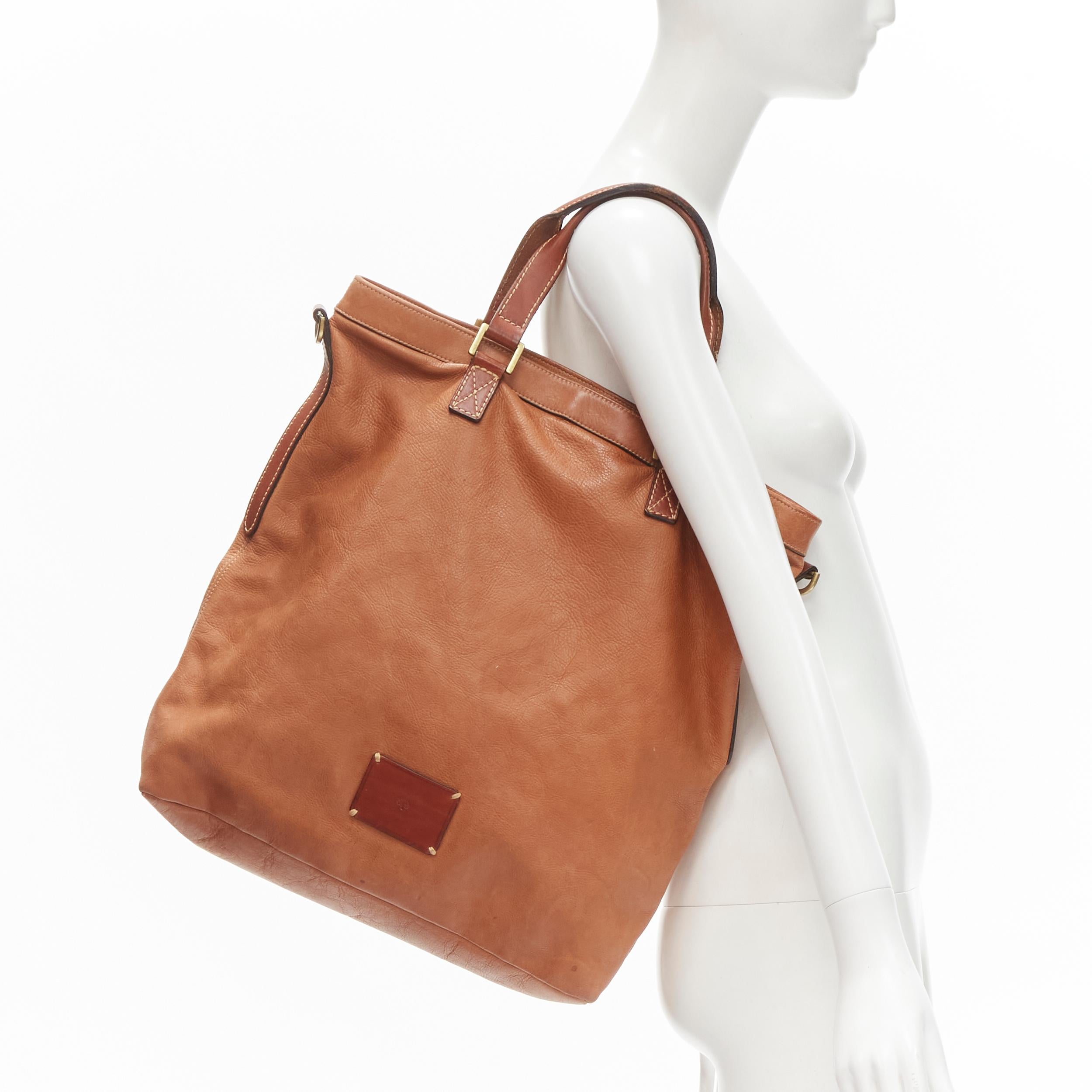 MULBERRY brown logo patch leather vertical tote bag 
Reference: CNLE/A00159 
Brand: Mulberry 
Material: Leather 
Color: Brown 
Pattern: Solid 
Closure: Zip 
Extra Detail: Gold-tone hardware. Double rolled handle. Overstitching detailing.