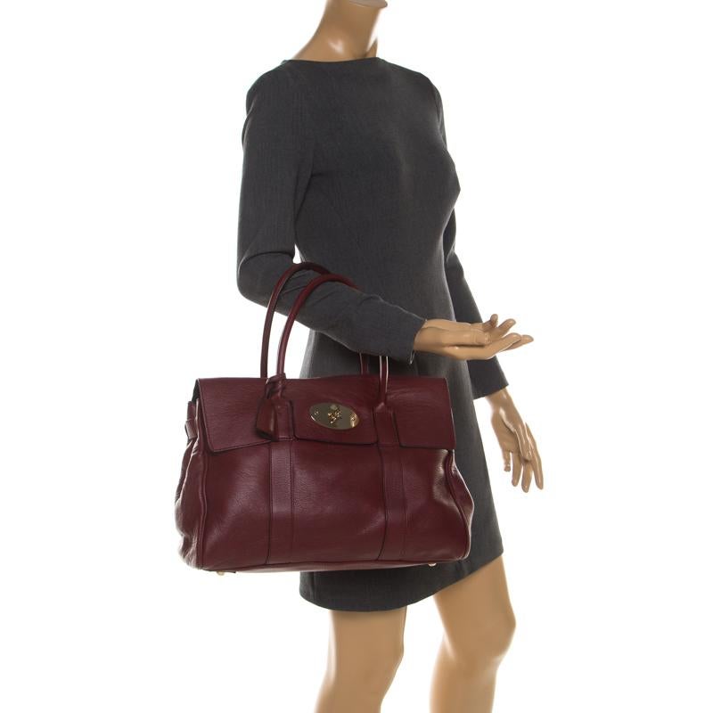 The Bayswater is one of the most well-known collections from Mulberry, so it's fair to say that this satchel is worth the buy. Crafted from burgundy leather, the bag is equipped with two handles and a turn lock on the flap securing a capacious
