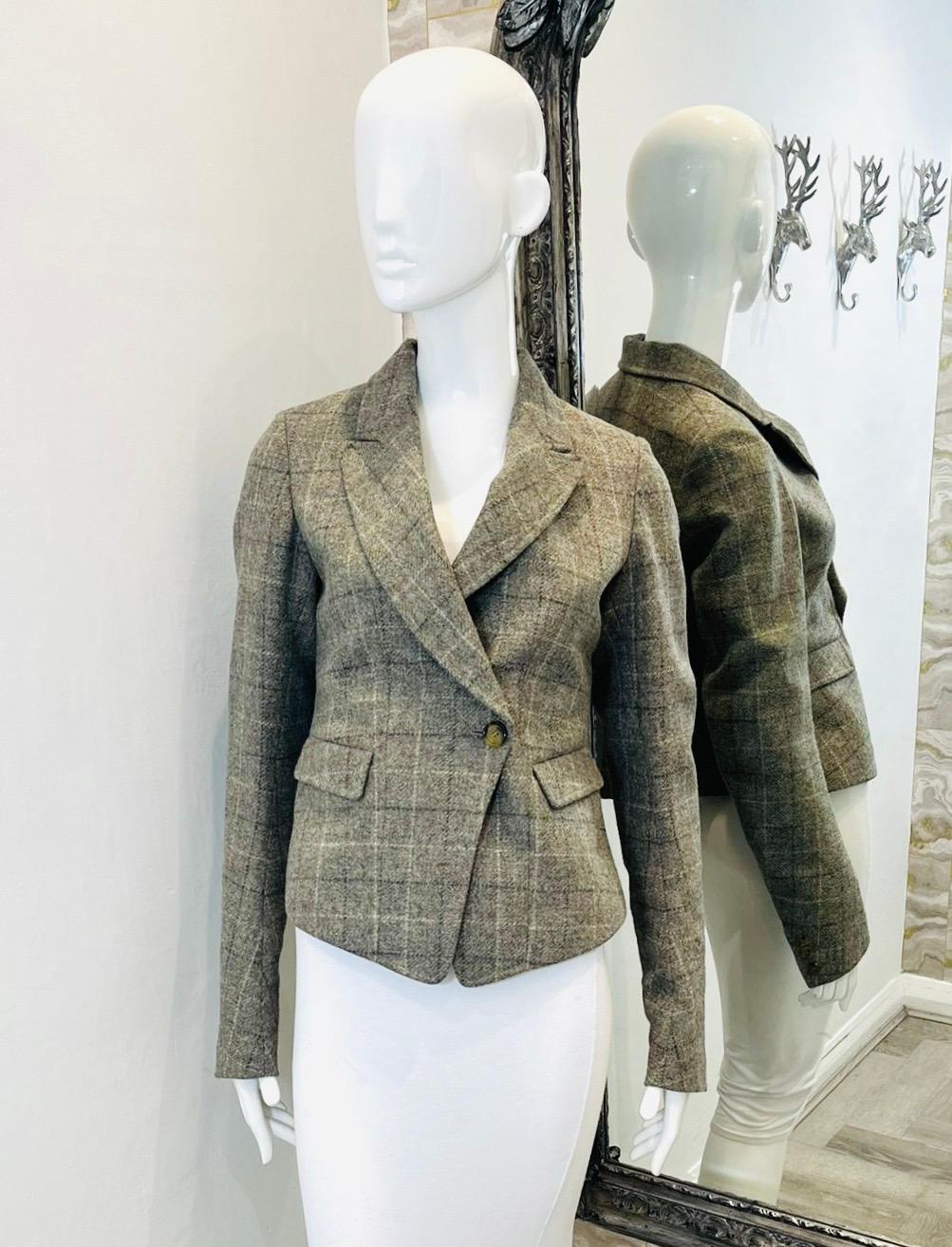 Mulberry Checked Jacket

Grey/brown blazer designed with single-breasted, asymmetric closure.

Detailed with notched lapels and flap pockets to the side.

Featuring long sleeves and buttoned cuffs.

Size – 38FR

Condition – Very Good

Composition –