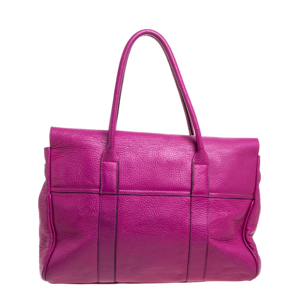 The Bayswater is one of the most well-known collections from Mulberry, so it's fair to say that this satchel is worth the buy. Crafted from fuchsia leather, the bag is equipped with two handles and a turn lock on the flap securing a spacious