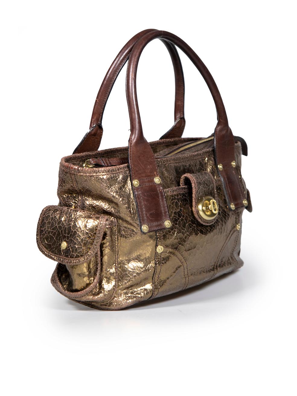 CONDITION is Good. General wear to bag is evident. Moderate signs of abrasion and wear to overall leather especially to the corners and bottom. Scratches and abrasion to handles, zipper pull and front clasp hardware on this used Mulberry designer