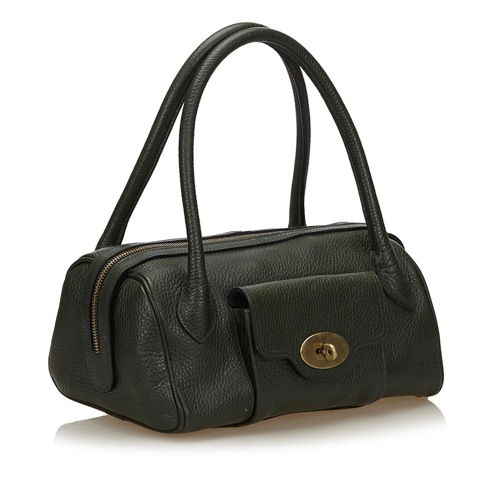 This handbag features a leather body, exterior front flap pocket with twist lock closure, rolled leather handles, top zip closure, and interior zip pocket. It carries as B+ condition rating.

Inclusions: 
This item does not come with