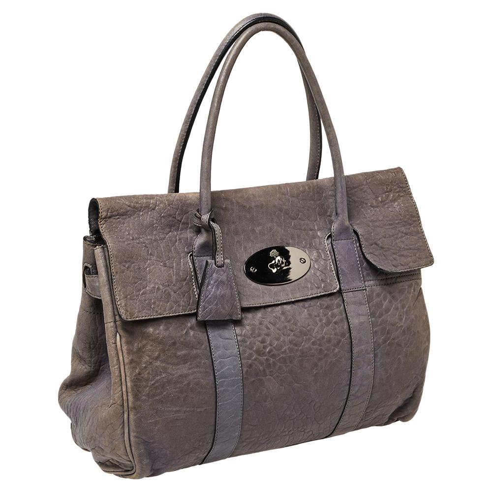 The Bayswater is one of the most well-known collections from Mulberry, so it's fair to say that this satchel is worth the buy. Crafted from grey leather, the bag is equipped with two handles and a turn lock on the flap securing a capacious
