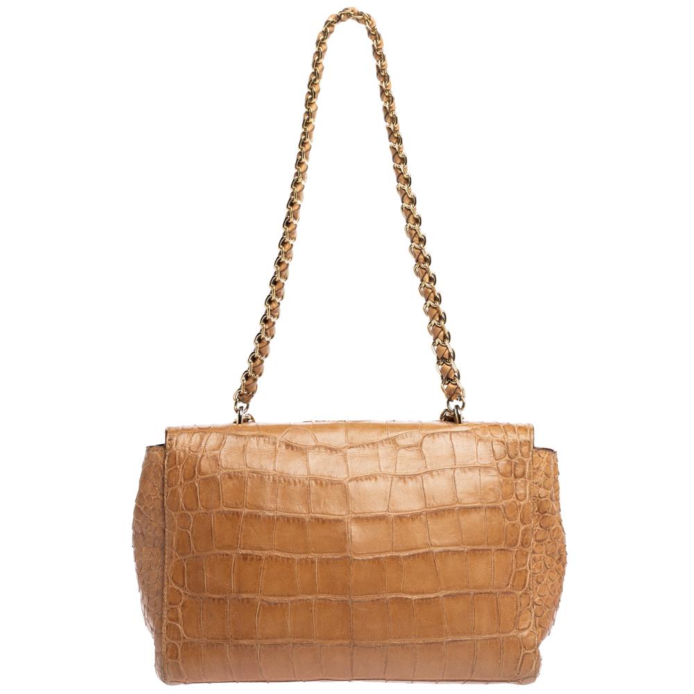 This Mulberry Lily bag is lovely. Crafted from croc-embossed leather, the beige bag comes with a chain and leather woven strap, a postman's lock on the flap and a suede-lined interior. It is ideal for everyday use.

Includes: Original Box, Original