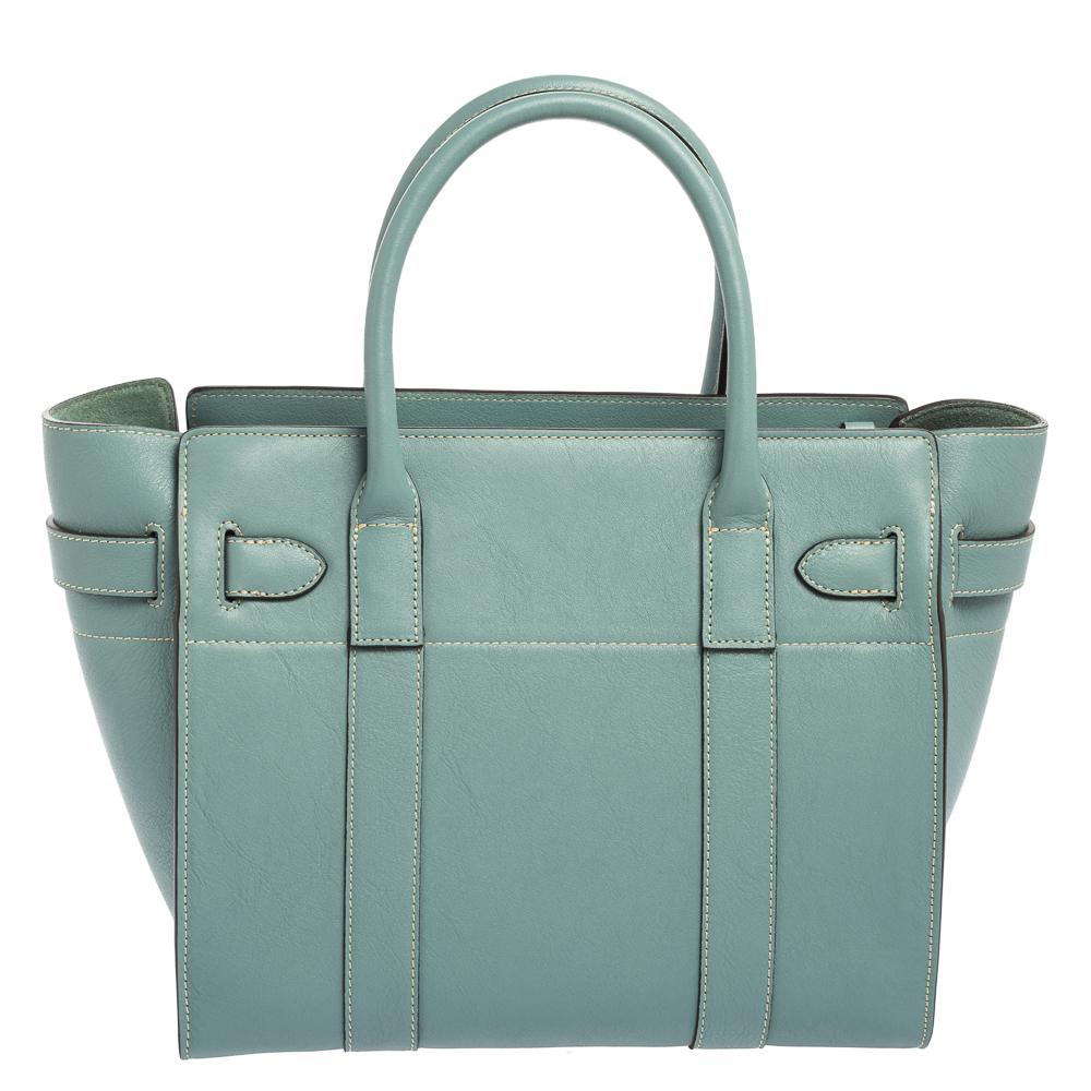 Introduce the Zipped Bayswater from Mulberry to your closet with this piece. Crafted from pale blue leather, this bag is equipped with two handles, belted turn-lock detail, a shoulder strap, and a lined compartment for your essentials.

Includes: