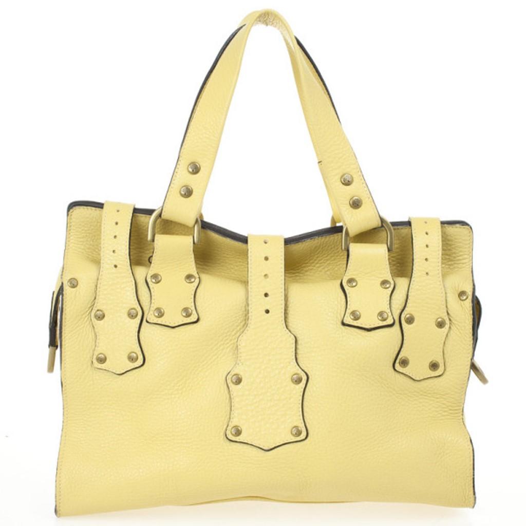 The much loved, but sadly discontinued Roxanne satchel by Mulberry is still a classic. This version is crafted from pale yellow leather that features stud detailing, gold-tone buckles, front pockets and comfortable double handles. The interior is
