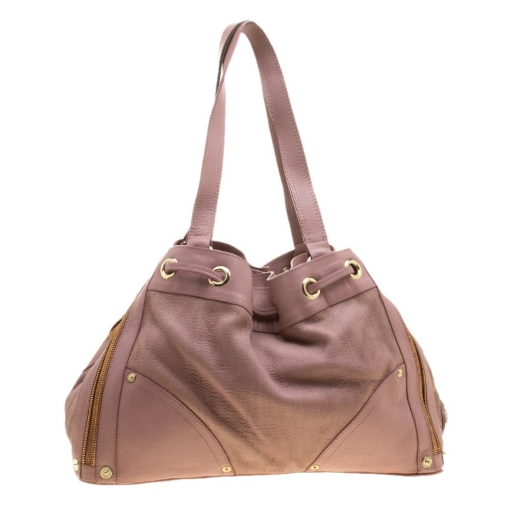 Carry this classy pink bag to bring out the fashionista in you. This marvellous piece from Mulberry is all that you need to instantly brighten your look. With a fabric lining, this one made from leather is all sleek and trendy.

Includes: Original