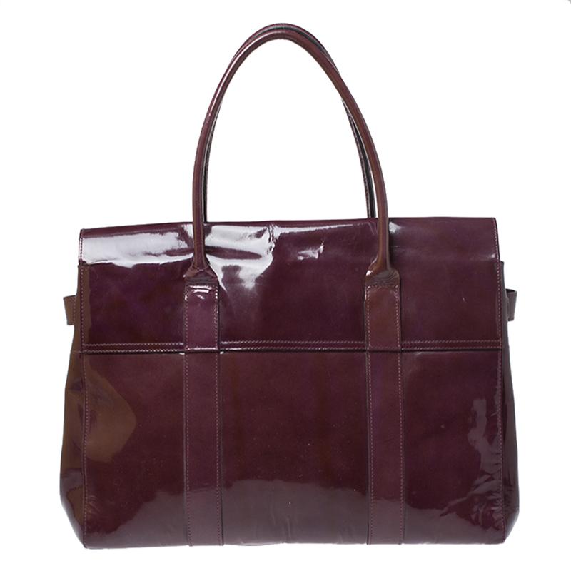 The Bayswater is one of the most well-known collections from Mulberry, so it's fair to say that this satchel is worth the buy. Crafted from glossy purple patent leather, the bag is equipped with two handles and a turn lock on the flap securing a