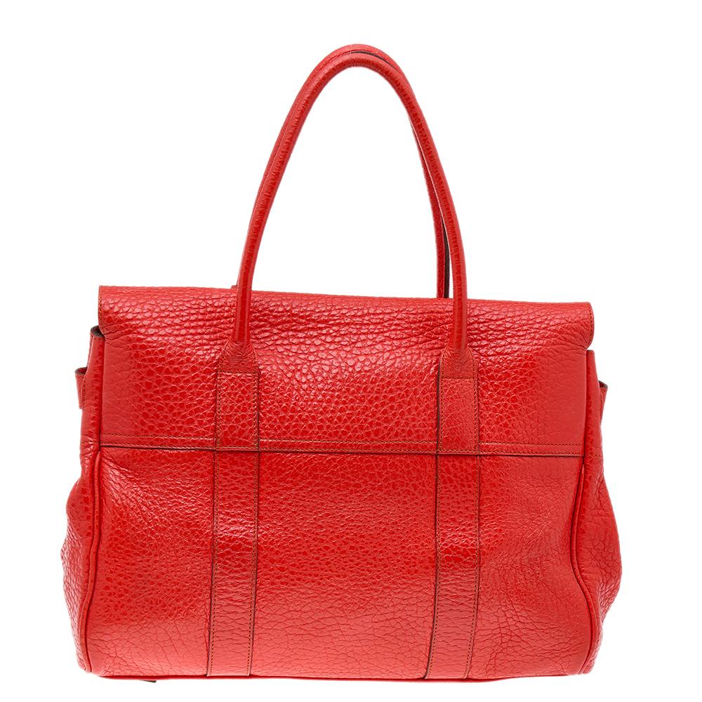 The Bayswater is one of the most well-known collections from Mulberry, so it's fair to say that this satchel is worth the buy. Crafted from red leather, the bag is equipped with two handles and a turn lock on the flap securing a capacious