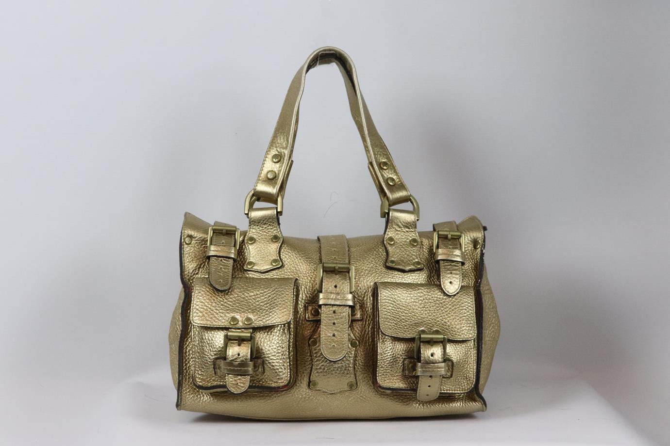 Mulberry Roxanne textured leather shoulder bag. Bronze. Magnetic snap fastening at front. Does not come with dustbag or box. Height: 8 in. Width: 13 in. Depth: 6 in. Strap Drop: 5 in. Fair condition - Marks on back, front, base and handles. Colour