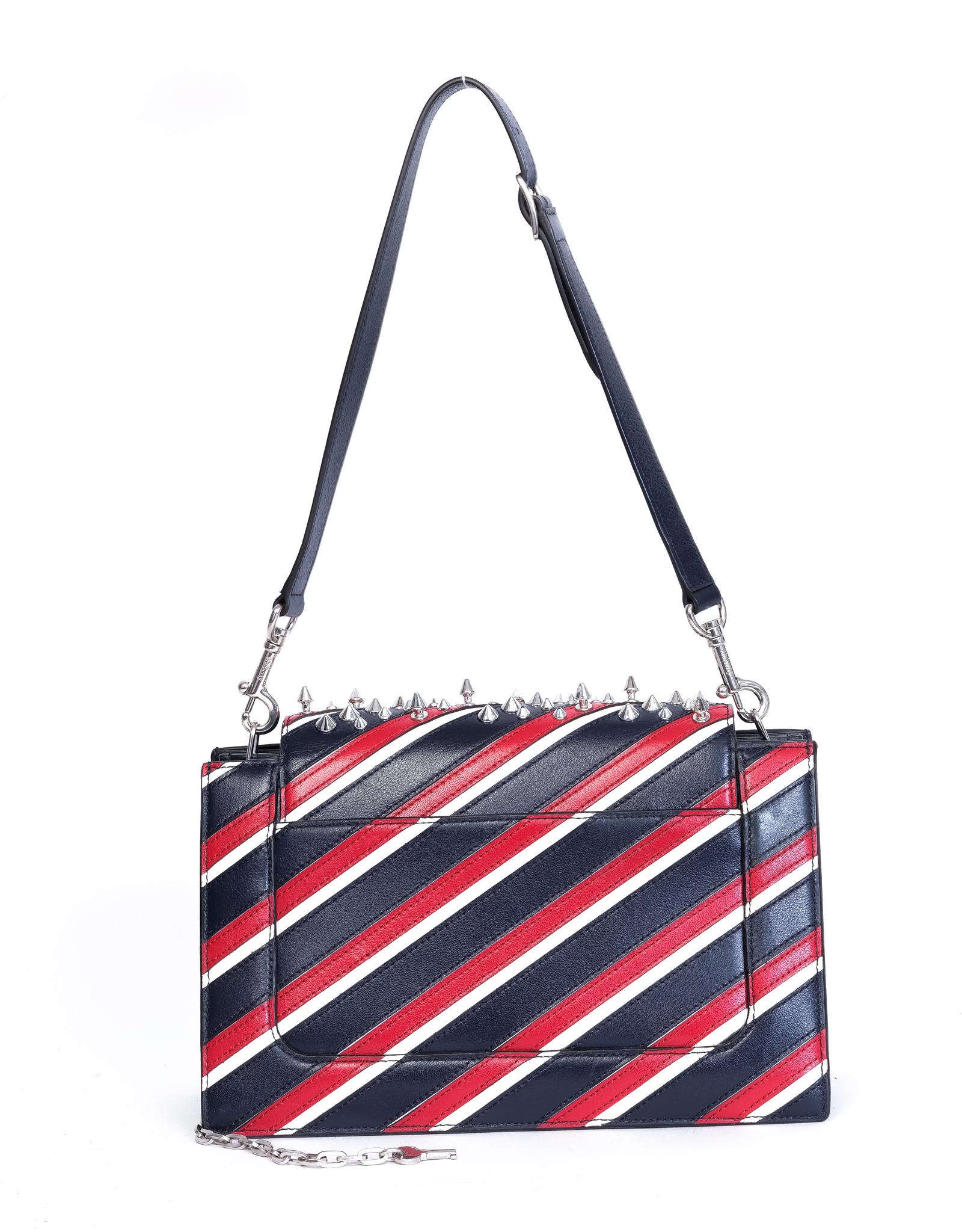 Leather bag from Mulberry with navy, red and white stripes with silver-tone studs and silver-tone hardware.

COLOR: Red, white, navy with sliver spikes
ITEM CODE: MAC
MATERIAL: Leather
MEASURES: H 7” x L 11 ” x D 5”
EST. RETAIL: $3000
COMES WITH: