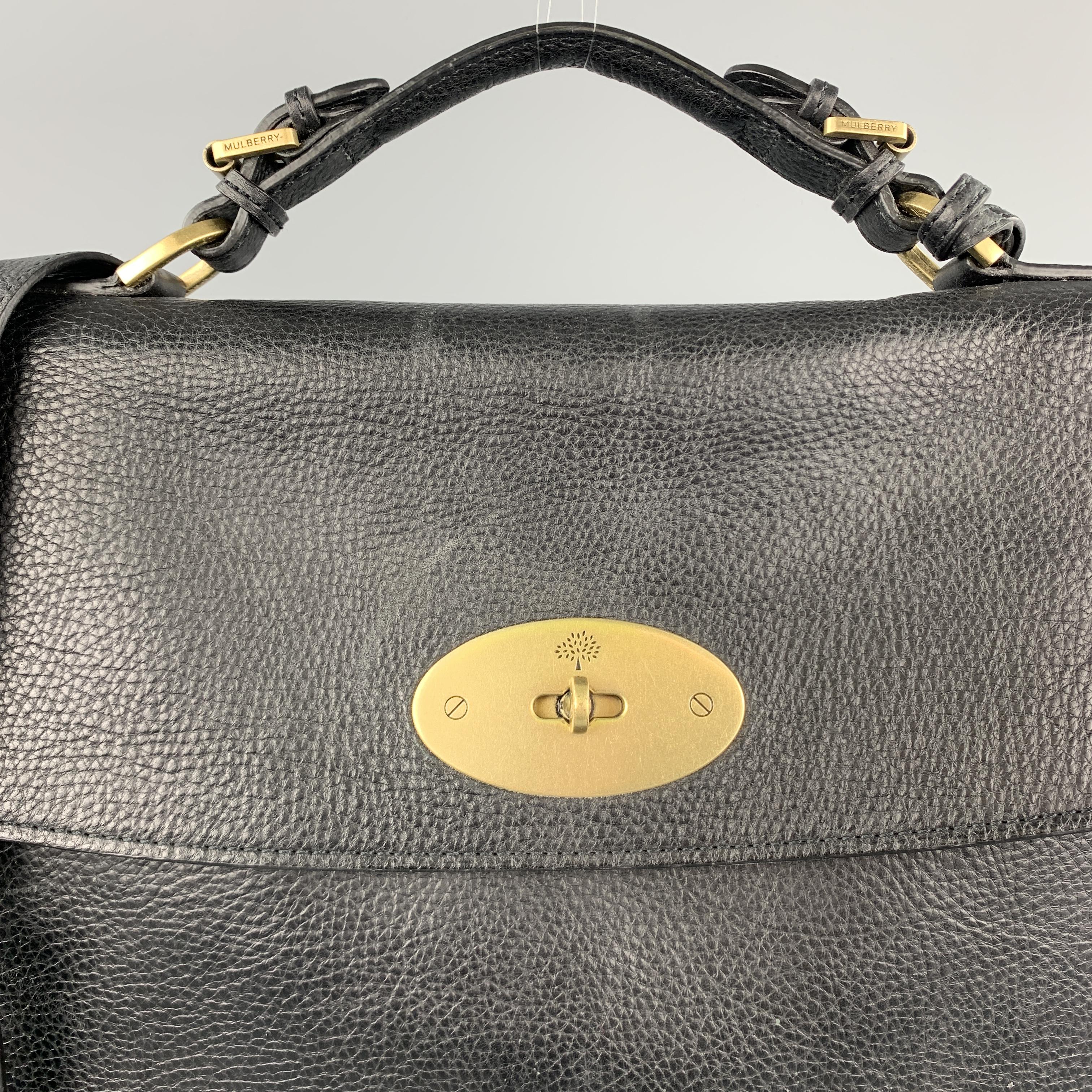 MULBERRY bag comes in a black pebble grain leather featuring a briefcase style, top handle, shoulder strap, and a locket closure. As Is.

Good Pre-Owned Condition.

Measurements:

Length: 14.5 in.
Width: 2.5 in. 
Height: 11 in. 
Drop: 20 in. 