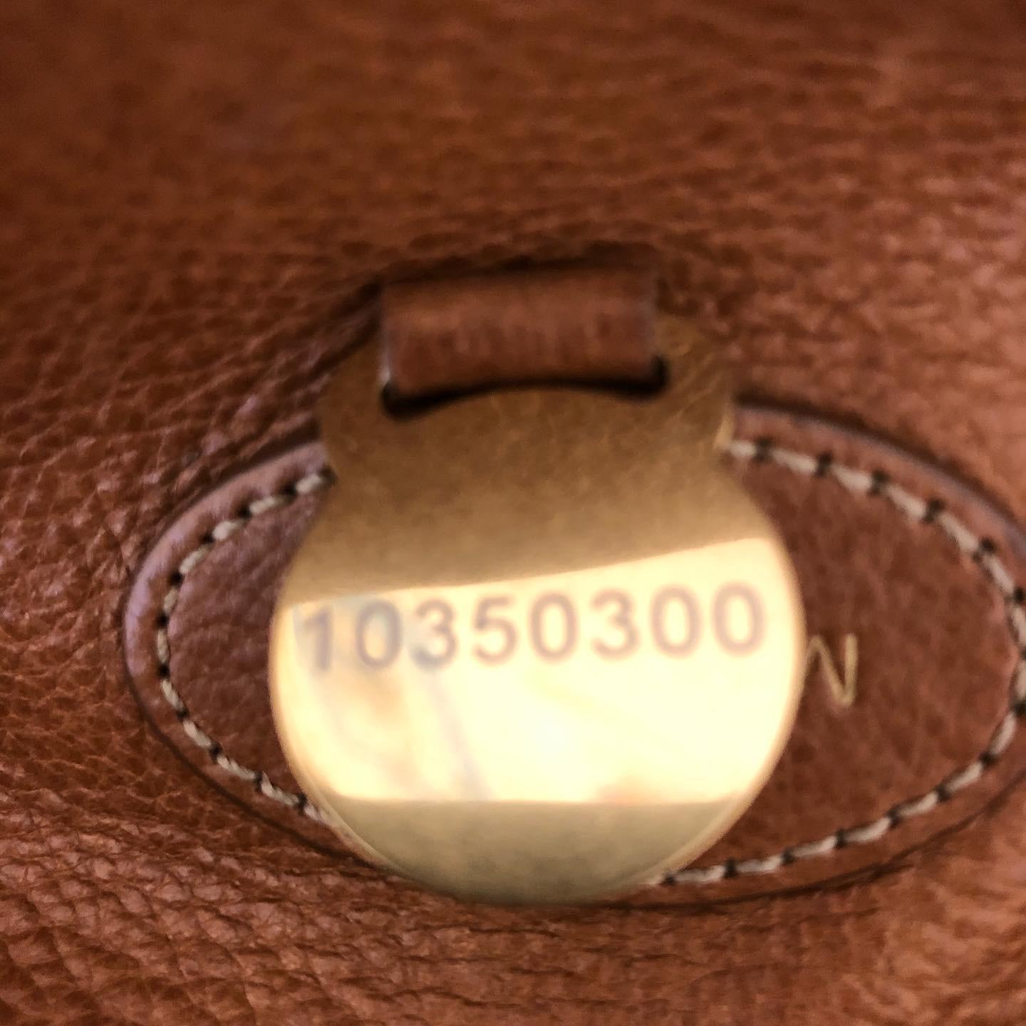 This is an iconic bag by UK company Mulberry known for its excellent craftsmanship. The handbag is in very good condition with plenty of storage room; a leather lining with a zipped pocket, and detachable strap. The key is missing, so I have marked