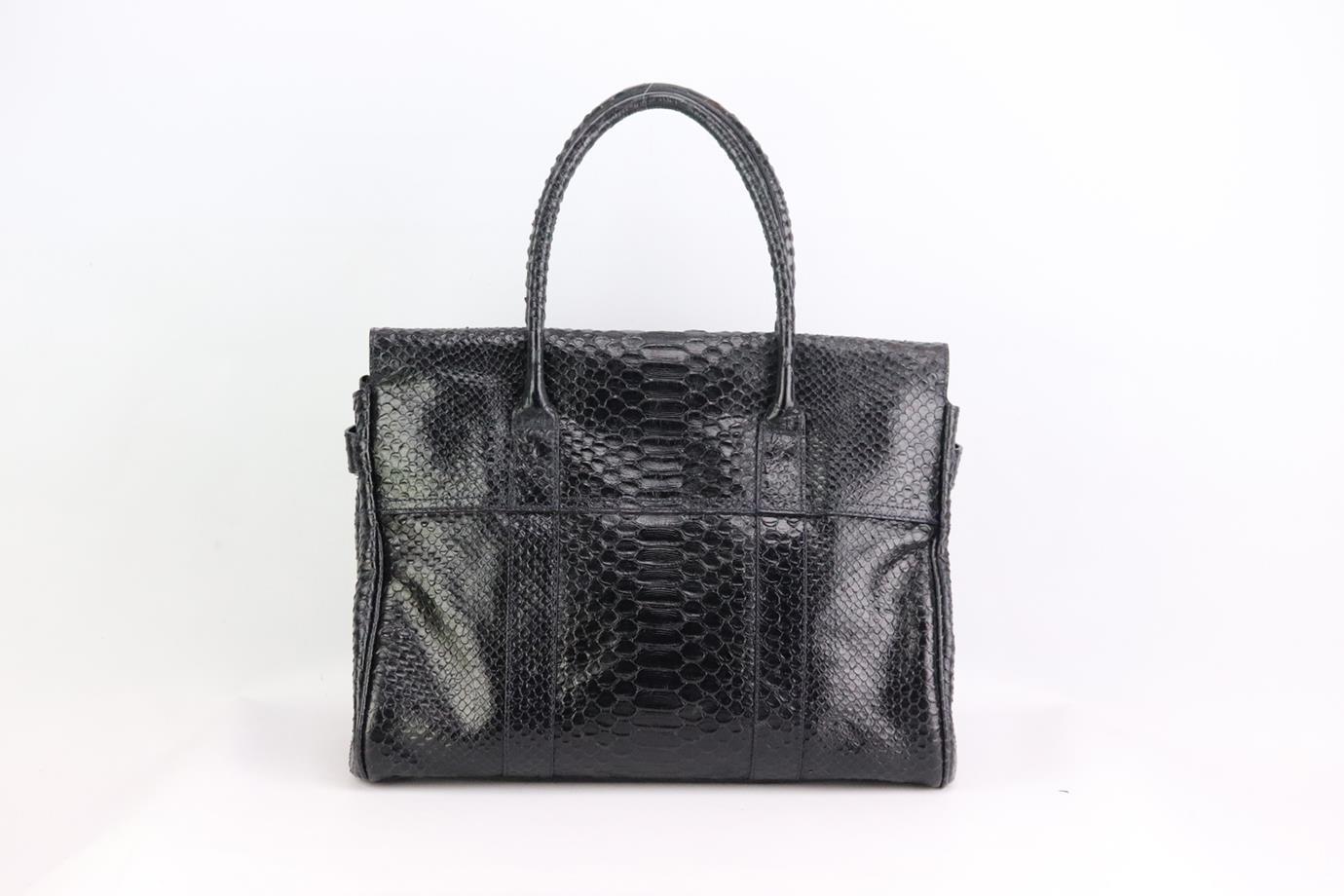 Mulberry The Bayswater python effect leather shoulder bag. Made from black python-effect leather with large interior compartment with zipped pocket. Black. Twist lock fastening at front. Comes with dustbag. Height: 11 in. Width: 14.5 in. Depth: 6