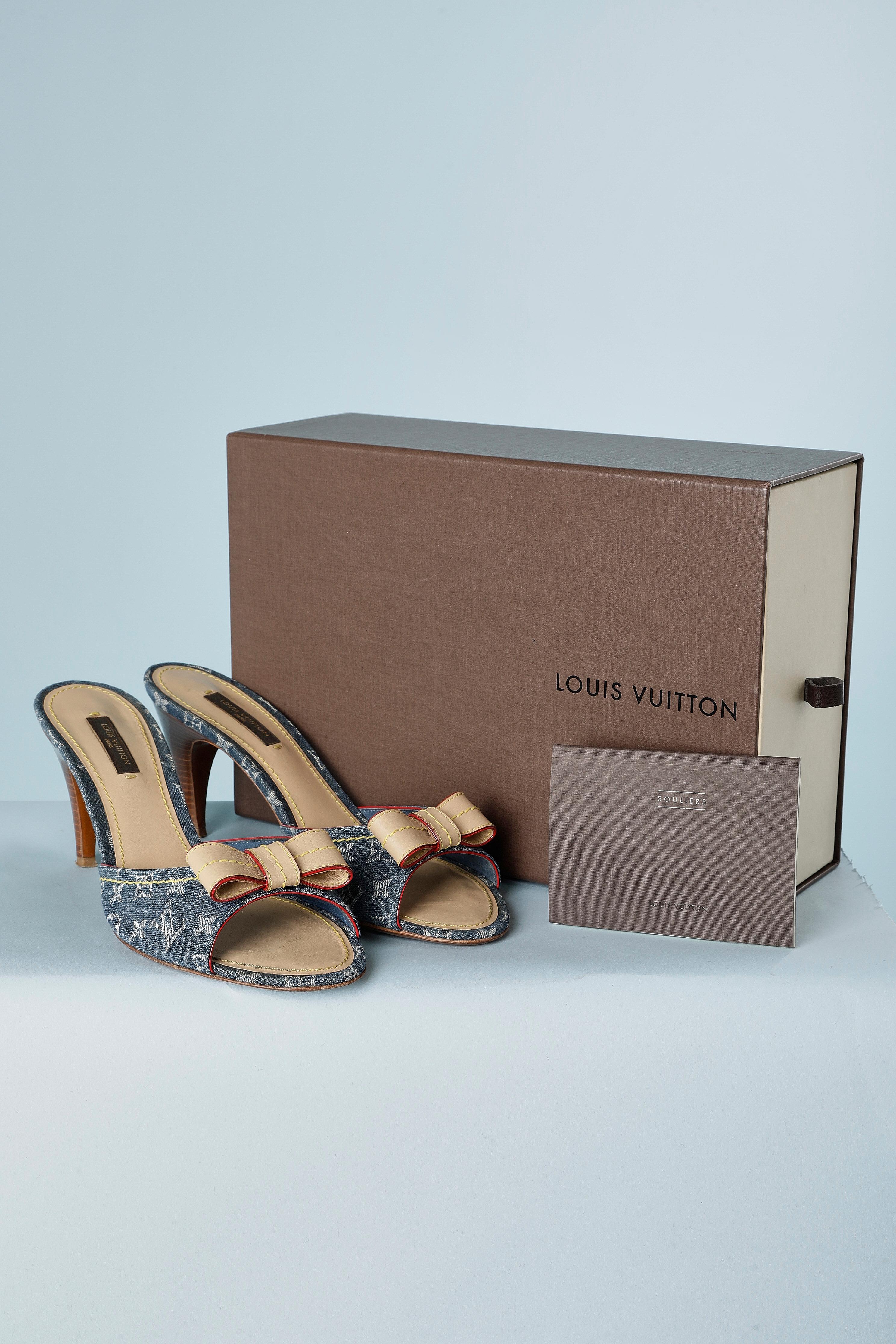 Mule sandal with branded cotton denim canevas. Shoe size 38 1/2 
Heel height = 8 1/2 cm
Provided with box.