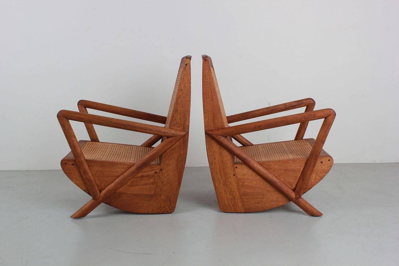 Gorgeous pair of teak and caned chairs based on a French design. Newly produced with wonderful lines. Caned seat and back.
Measures: H 34.5 in. x W 24 in. x D 27 in.

 
