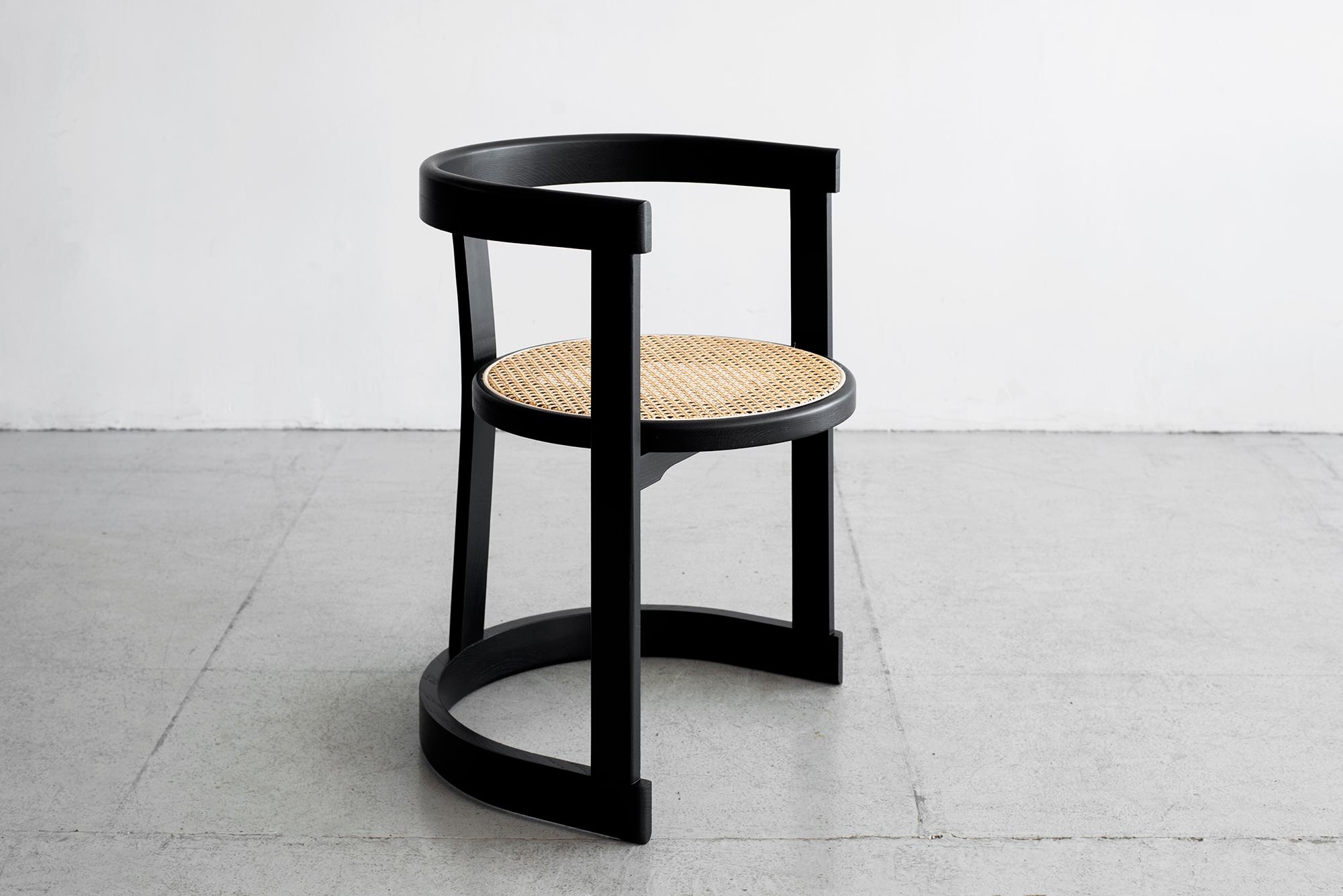 Wonderfully curved bentwood French oak dining room chairs with caned seat.
Newly produced by Orange Furniture collection.
Shown in ebony finish, also available in cerused oak.