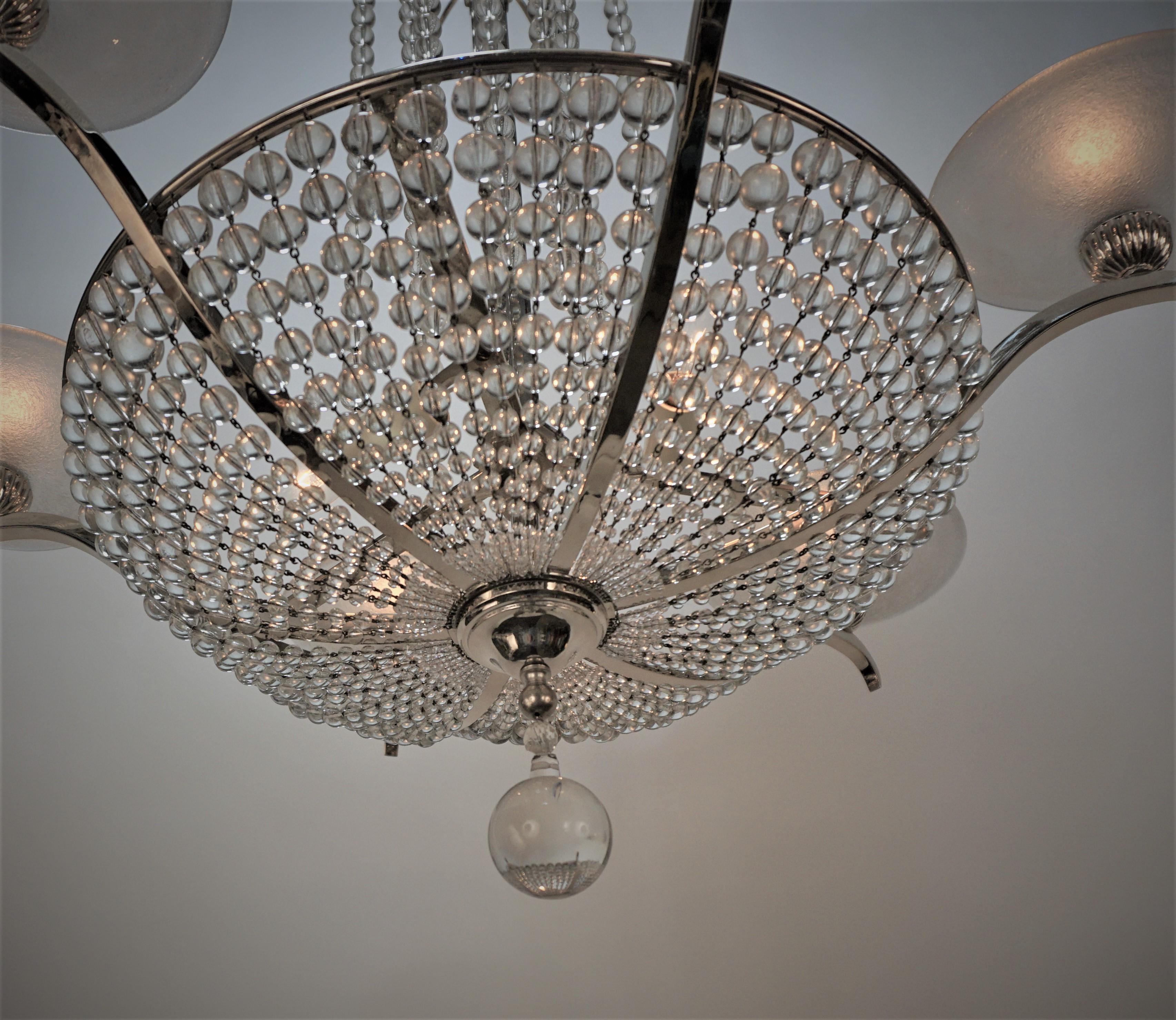 French 1930's crystal chandelier with acid texture glass shades and nickel on bronze frame.