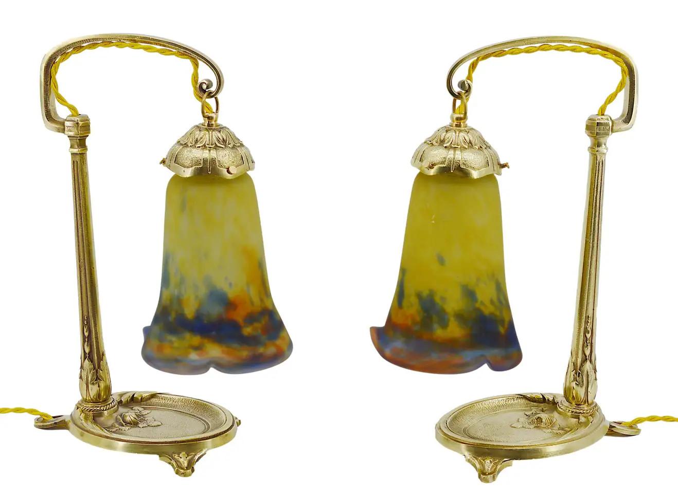 Pair of French Art Deco table lamps by Muller Freres (Luneville) and Charles RANC (Paris), France, ca.1920. Mottled glass shades by Muller Freres, stretched with the tool, powders are applied between two layers, that come on their beautiful bronze