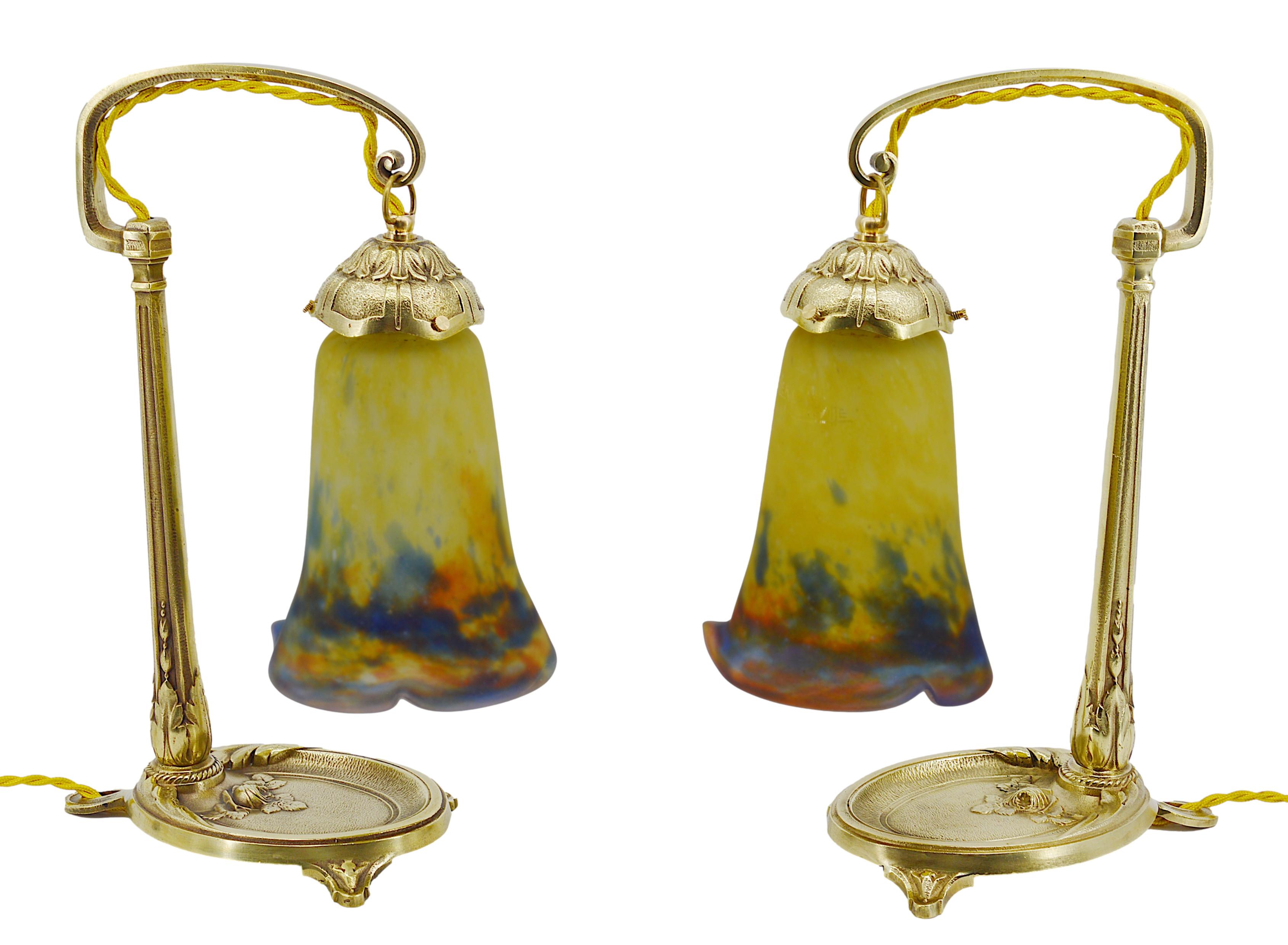 Pair of French Art Deco table lamps by Muller Freres (Luneville) and Charles RANC (Paris), France, ca.1920. Mottled glass shades by Muller Freres, stretched with the tool, powders are applied between two layers, that come on their beautiful bronze