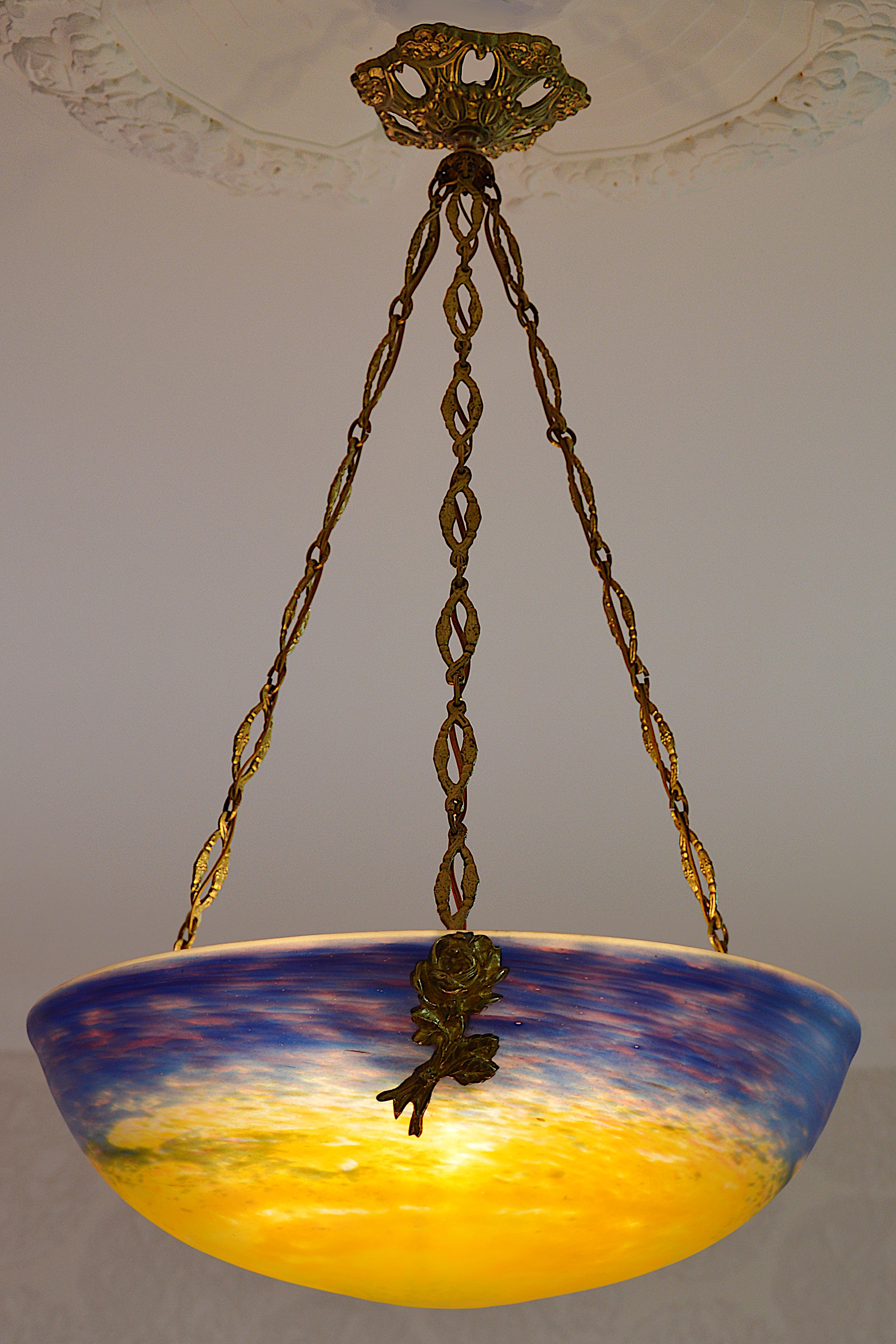 French Art Deco pendant by Muller Freres, Luneville, France, Early 1920s. Mottled glass shade, powders are applied between two layers that comes hung at its original solid bronze fixture by Charles RANC (Paris). Measures: Height 25.6