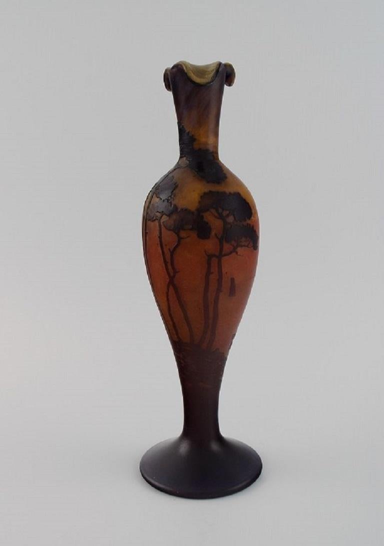 Muller Frères, France. 
Vase in smoky and dark art glass carved in the form of branches with flowers and foliage. 1920s.
Measures: 28 x 9 cm.
In excellent condition.
Signed.