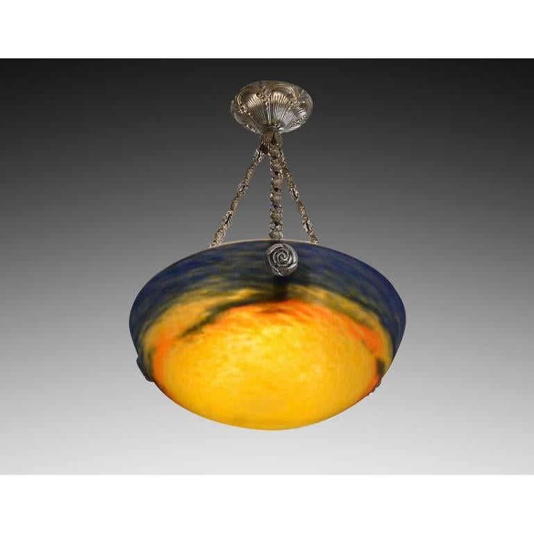 French Art Deco chandelier by Muller Freres (Croismare), 1920s. Mottled blown thick double glass shade showing yellow, dark blue and red/orange colors on its metal fixture. Signed 