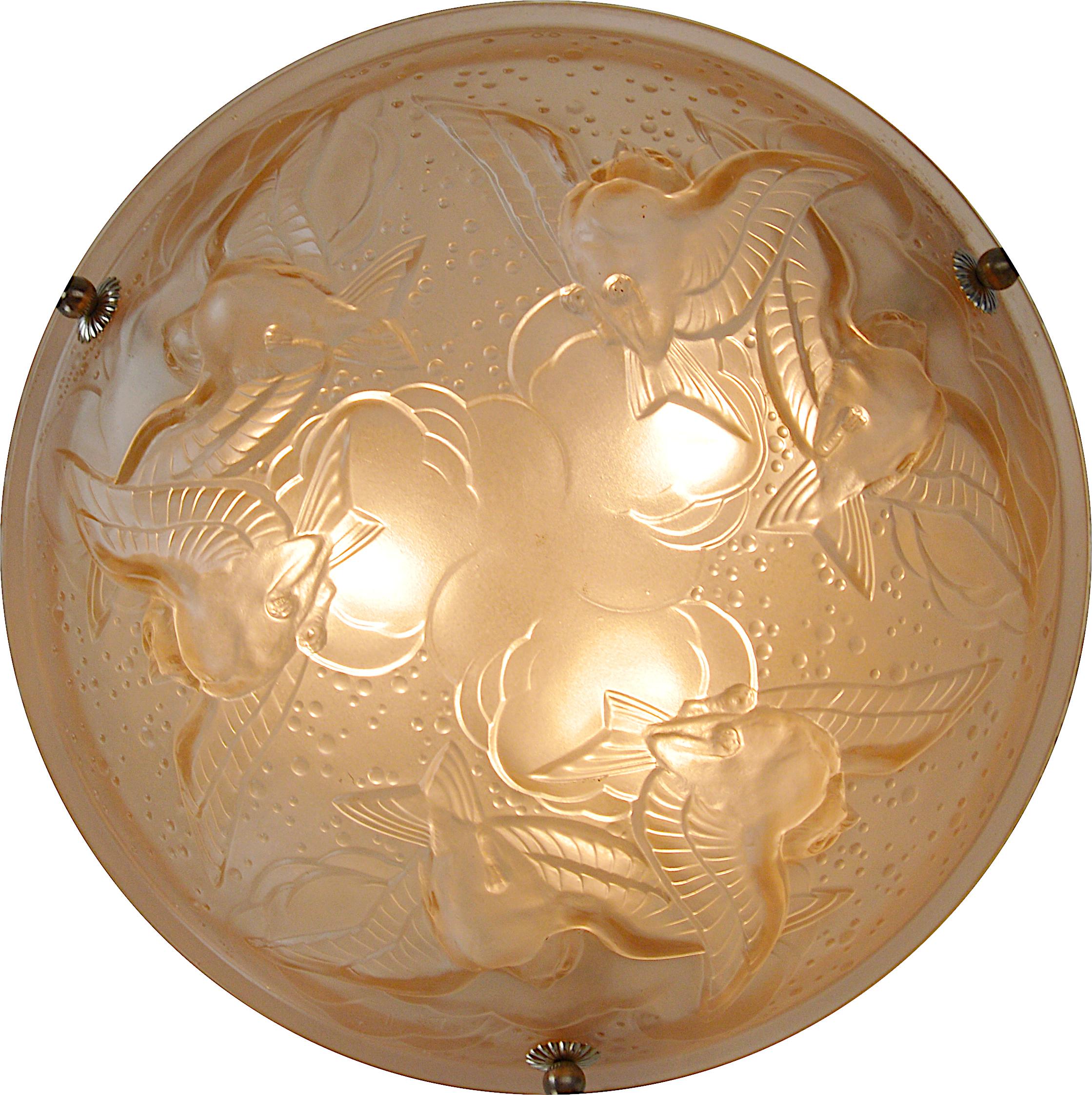 French Art Deco bird pendant chandelier by Muller Frères (Luneville), France, circa 1925. Pink molded frosted glass shade showing 6 swallows in the sky (clouds). Silver plated solid bronze (canopy) and stamped brass fixture. Measures: Height