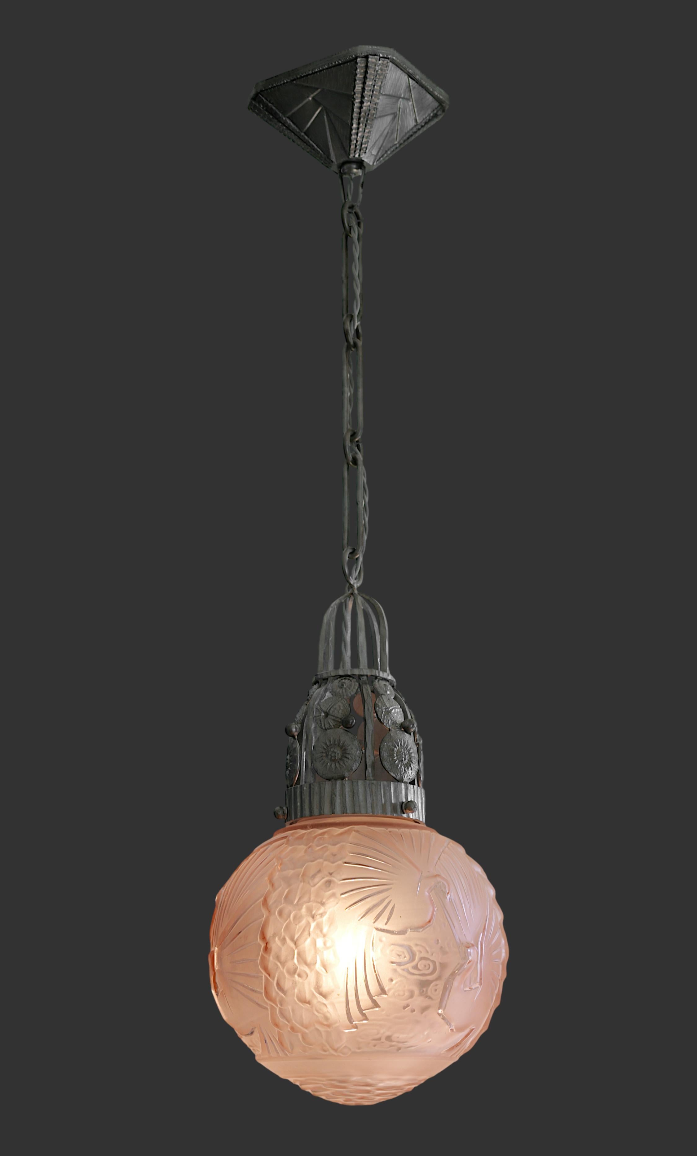 French Art Deco pendant chandelier by MULLER FRERES (Luneville) and Marcel VASSEUR, France, 1920s. Glass and wrought-iron. Sharply defined pink frosted glass shades by Muller Freres. Superb wrought-iron fixture by Marcel Vasseur. Height :35.4