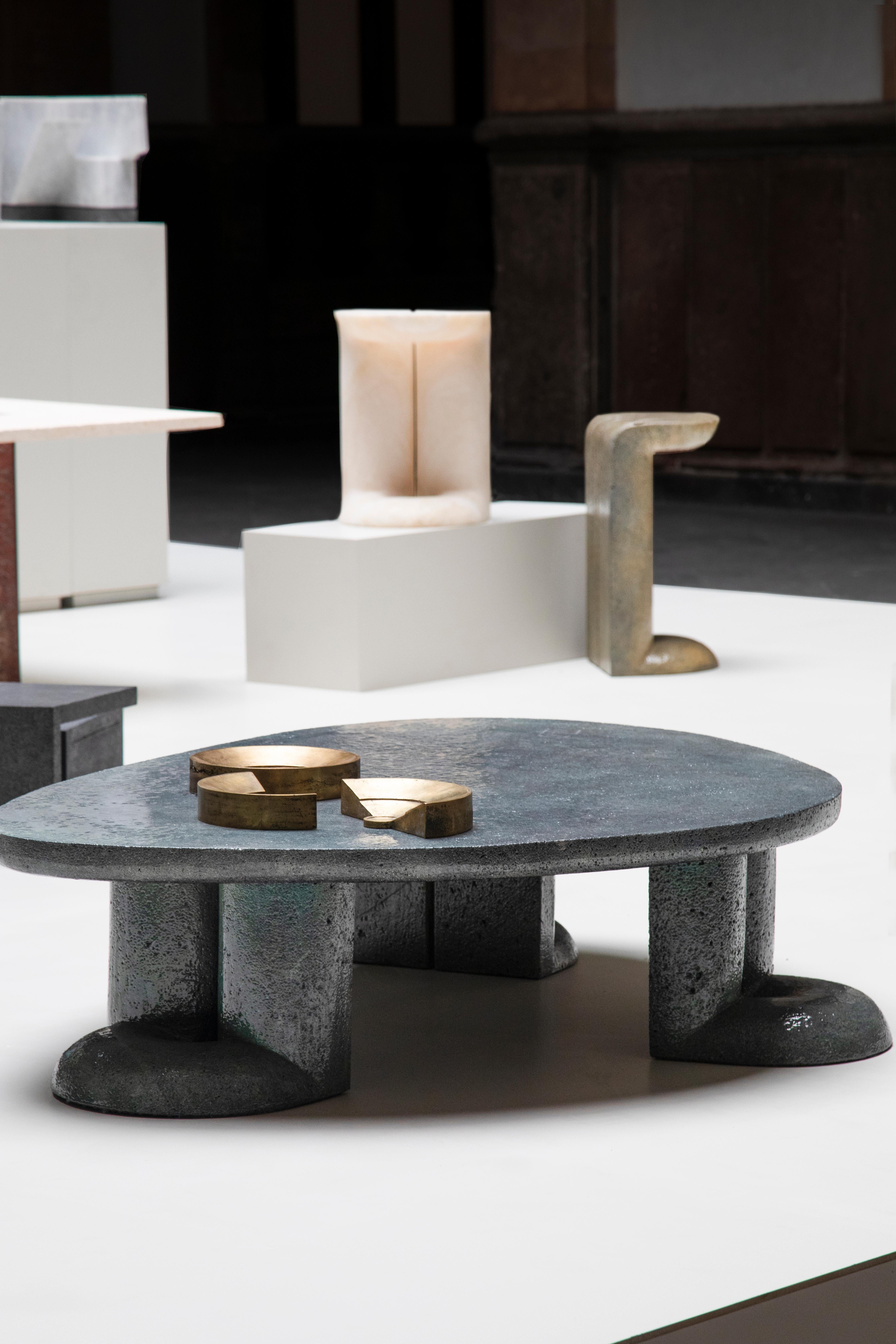 Mullunu Coffee Table (2020) — by Ian Felton
Hand-carved lava stone coffee table with glossy ceramic color finish.

Mullunu Coffee Table, with its aquamarine and golden colors— materializes some of nature’s most treasured memories: the dancing rays
