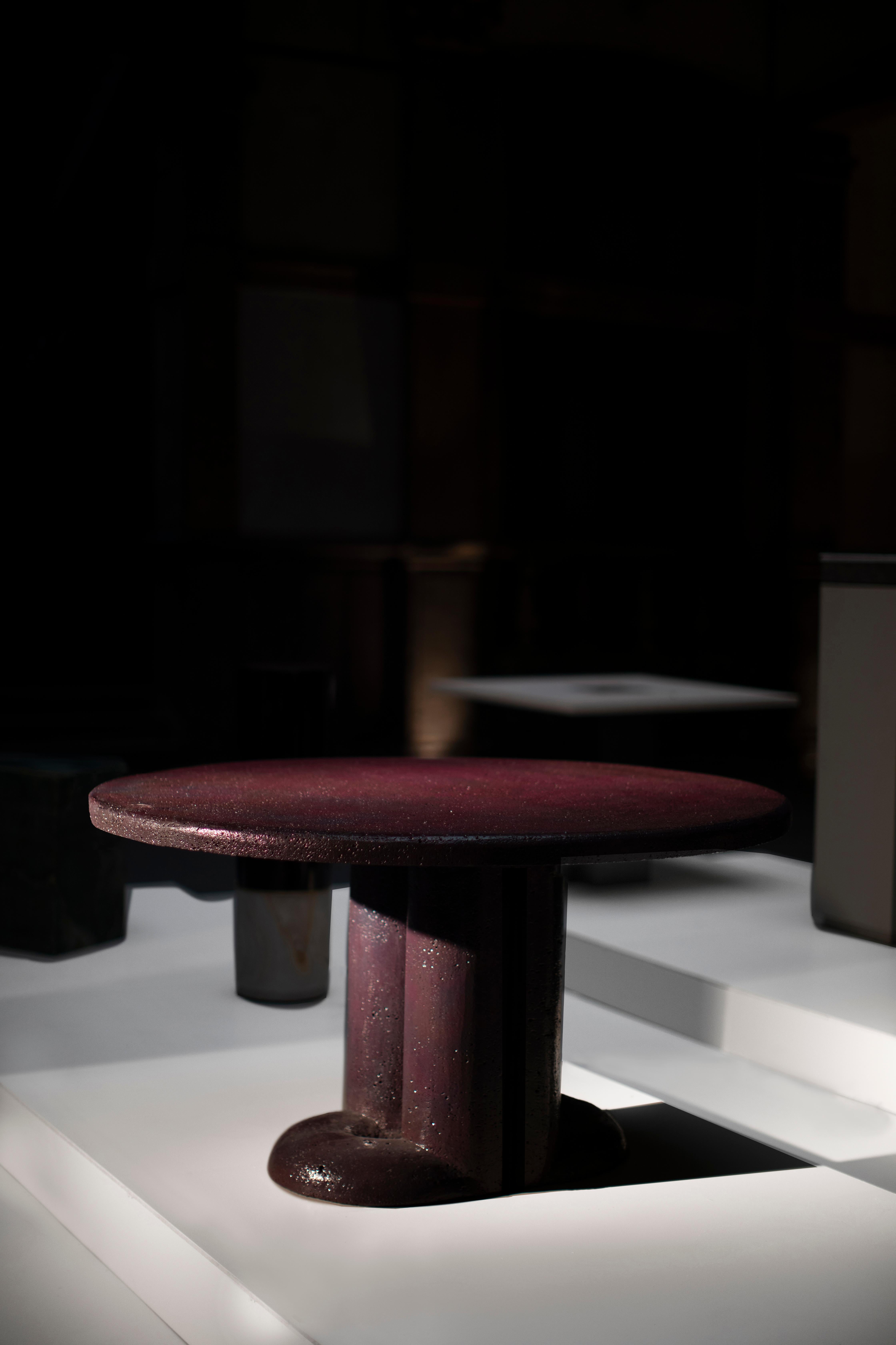 Mullunu Dining Table (2020) by Ian Felton
Hand carved lava stone with glossy ceramic color glaze
Limited Edition 15

Mullunu dining table, a bold statement piece that —like vivid dreams— arouses indelible impressions on its viewer and becomes an