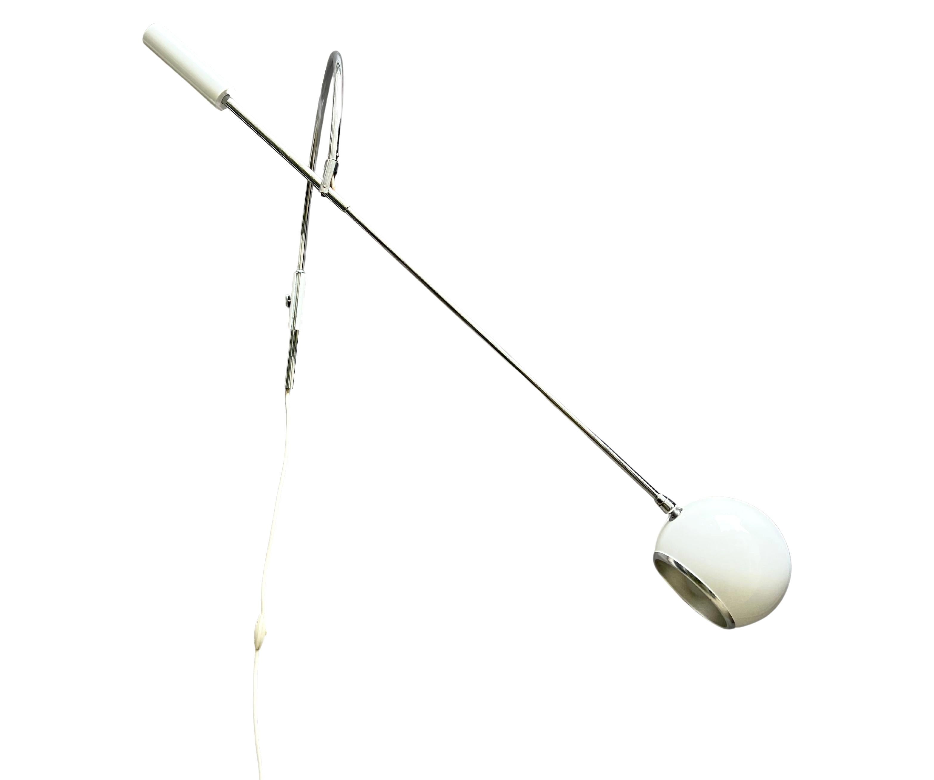 Arcing swivel and tilt counter balanced wall mounted task or reading lamp. 
Robert Sonneman design for Sonneman lighting. 
Horizontal shaft is 39.37