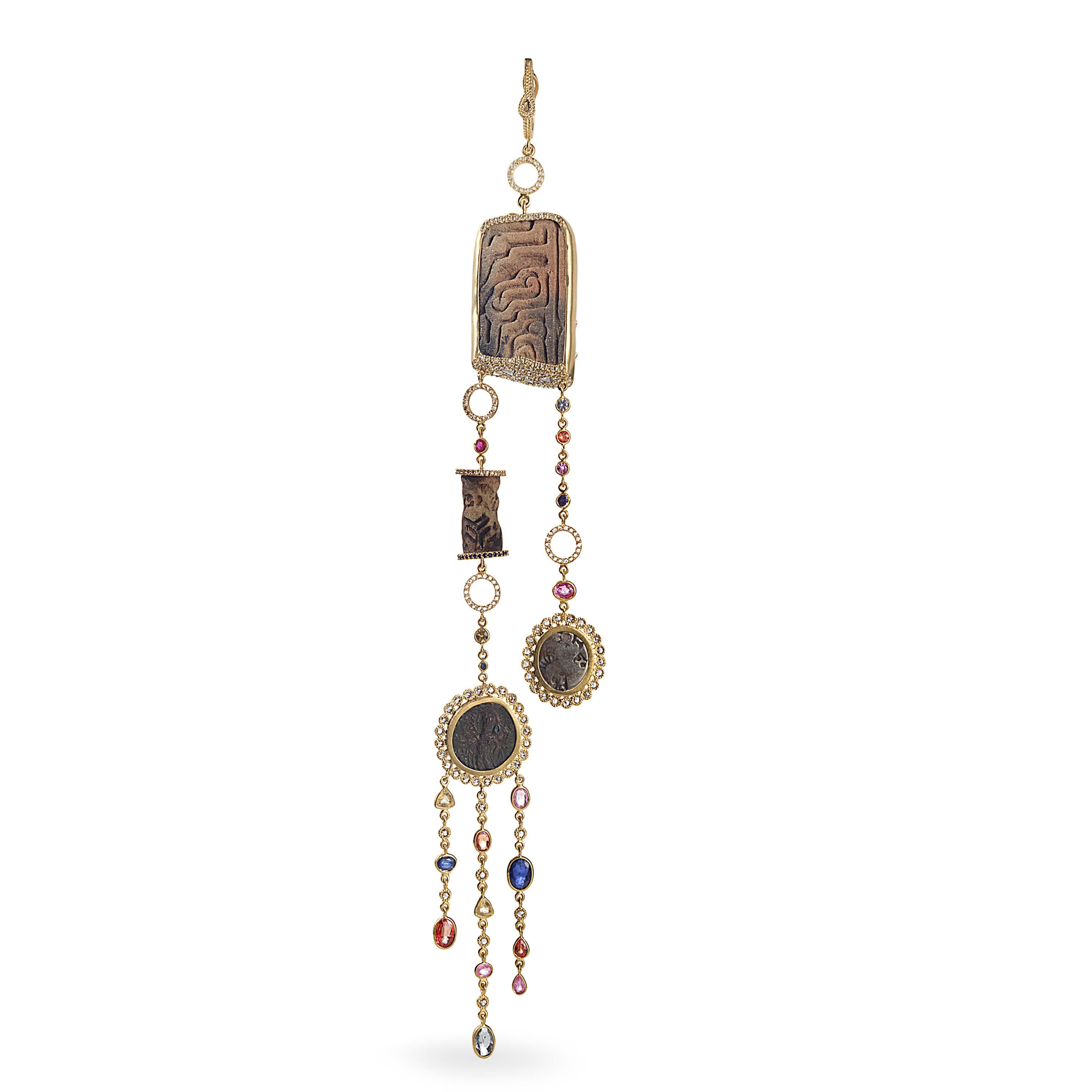 Ancient 20 karat Yellow Gold Pendant with Ecuadorian Flat Stamp, Neo-Assyrian Faience Cylinder Seal, and 6.46-carat Multi-color Sapphires. This Pendant Comes With A Small Kushan Coin and Indo Shai Coin As Well On the Pendant All Set with 3.26-carat