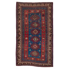 Antique Multi-Bordered Kazak with Tribal Geometric Influence in Reds and Blues 
