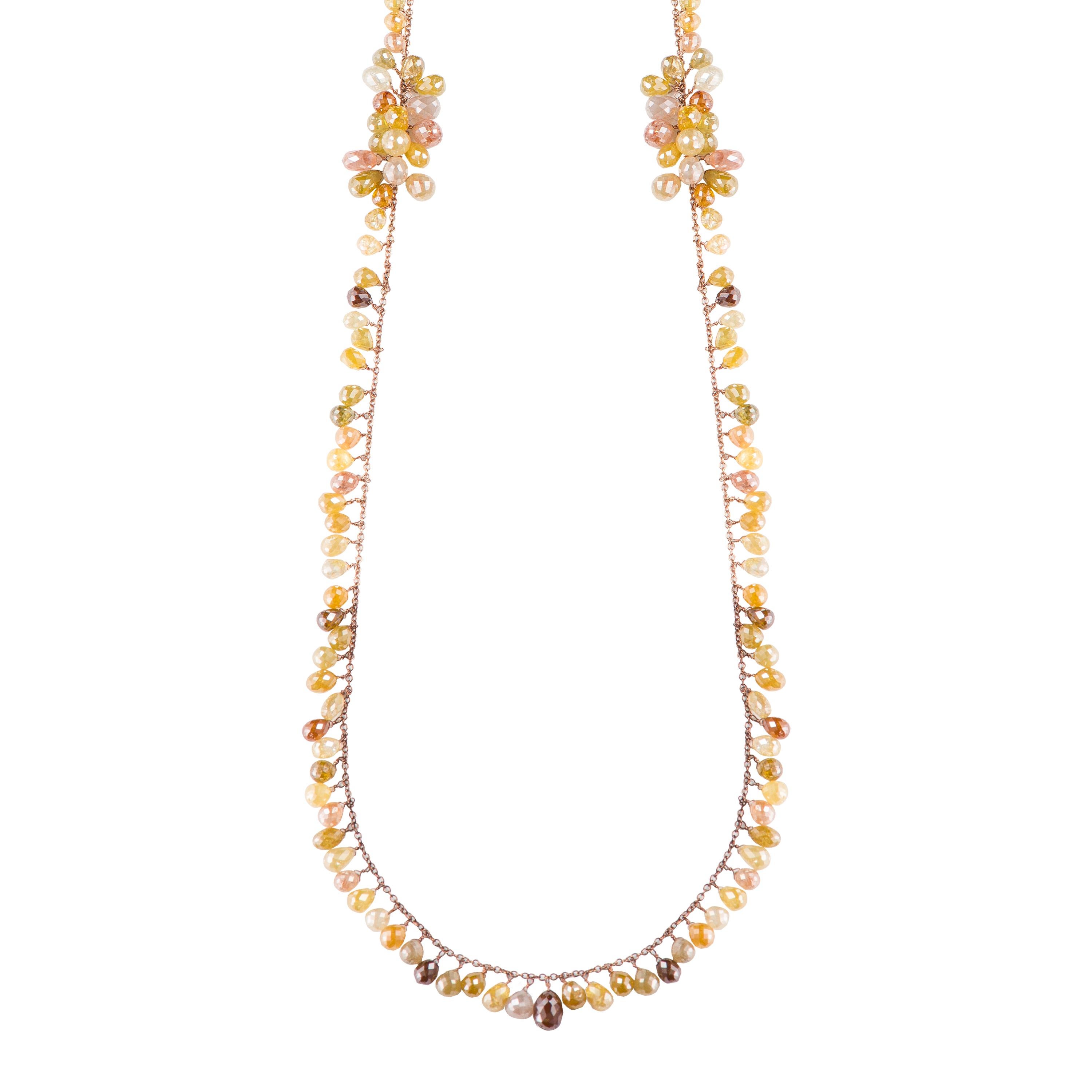 This one-of-a-kind 18k rose goldchain necklace features multicolor briolette cut diamond beads. Diamond beads dangle from the chain. In the mid section there are clusters of diamonds. A total weight of 140 carats were used in making this chain. The
