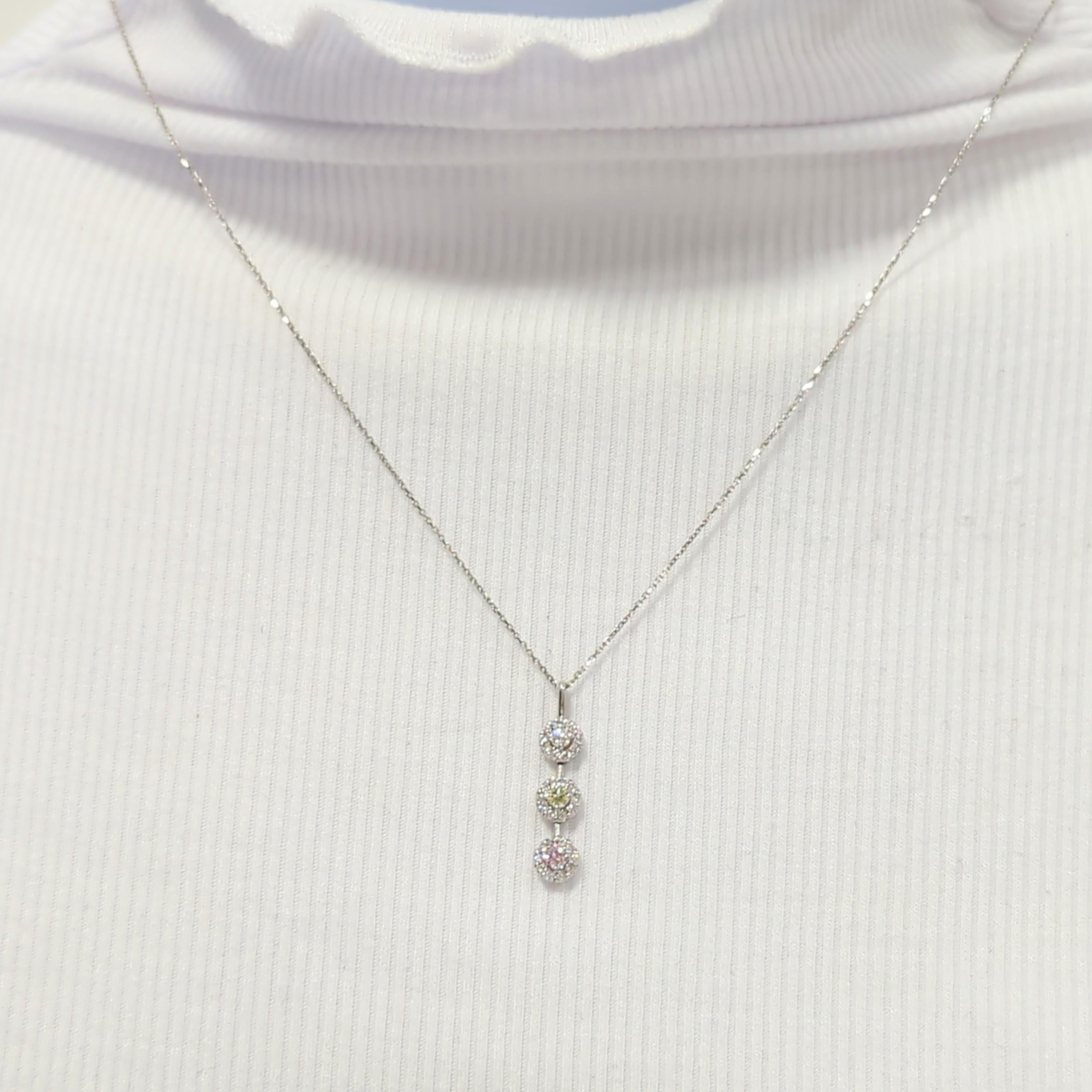 Beautiful 0.47 ct. multicolor round diamonds in this pendant necklace.  Handmade in 18k white gold.  Length is 18