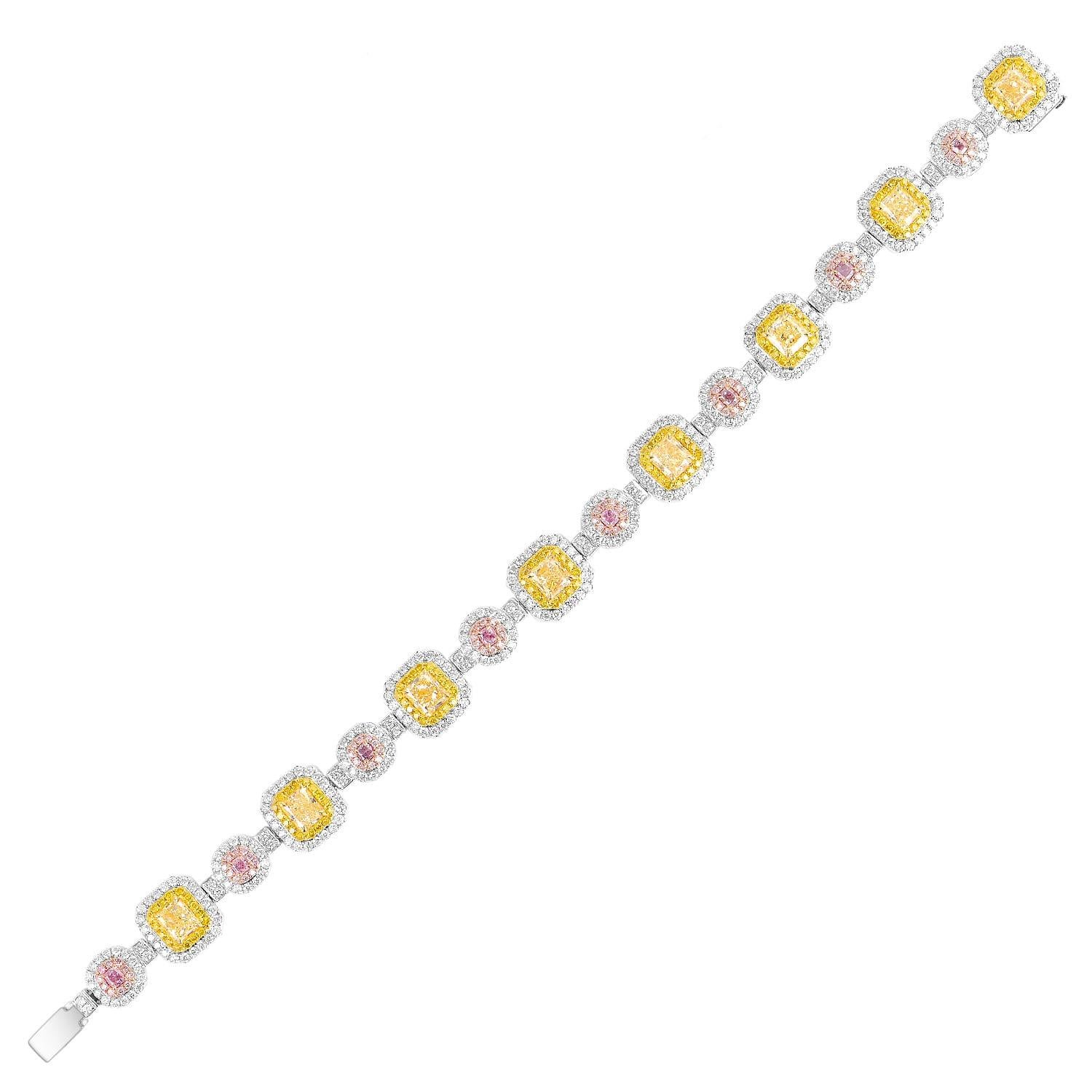 Material: 18k White Gold
Radiant Diamond Details: Approximately 5.64ctw of Radiant cut diamonds. Diamonds are Fancy Yellow in color and VS in clarity
Cushion Diamond Details: Approximately 0.57ctw of Cushion cut diamonds. Diamonds are Fancy Pink in