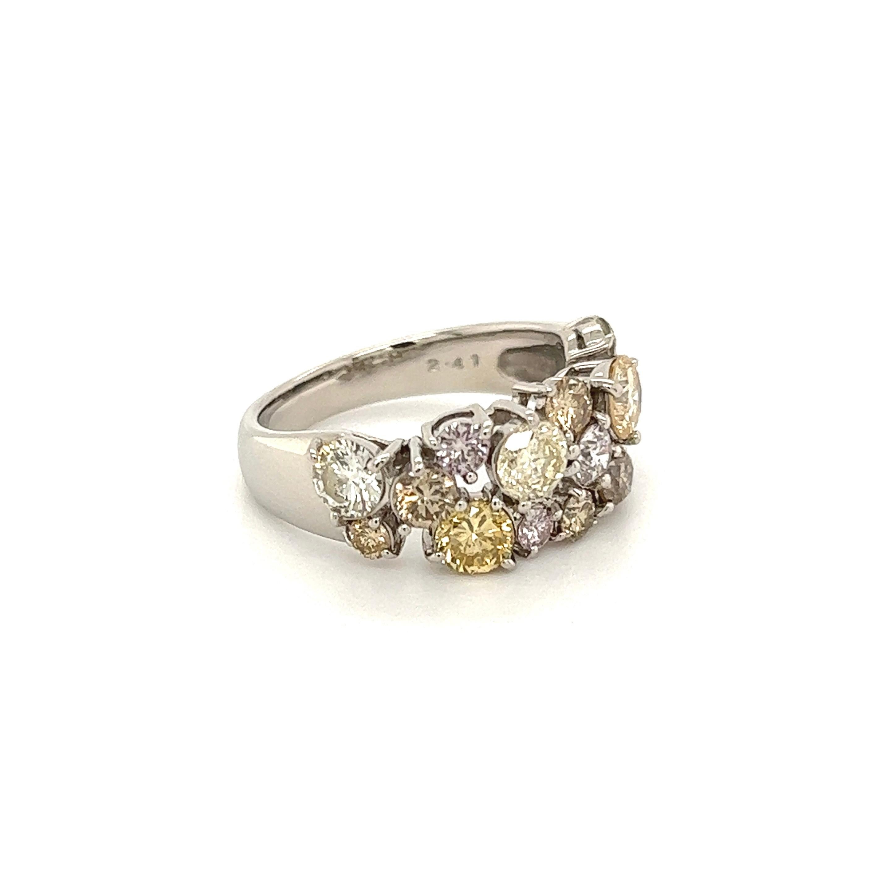 Simply Beautiful! Multi-Color Diamond Cocktail Band Ring. Securely Hand set with Diamonds, Brown to pink, SI-I1, weighing approx. 2.41tcw. Hand crafted in 18 Karat White Gold. Measuring approx. 0.89” w x 0.84” h x 0.36” d. Ring size 6.25, we offer